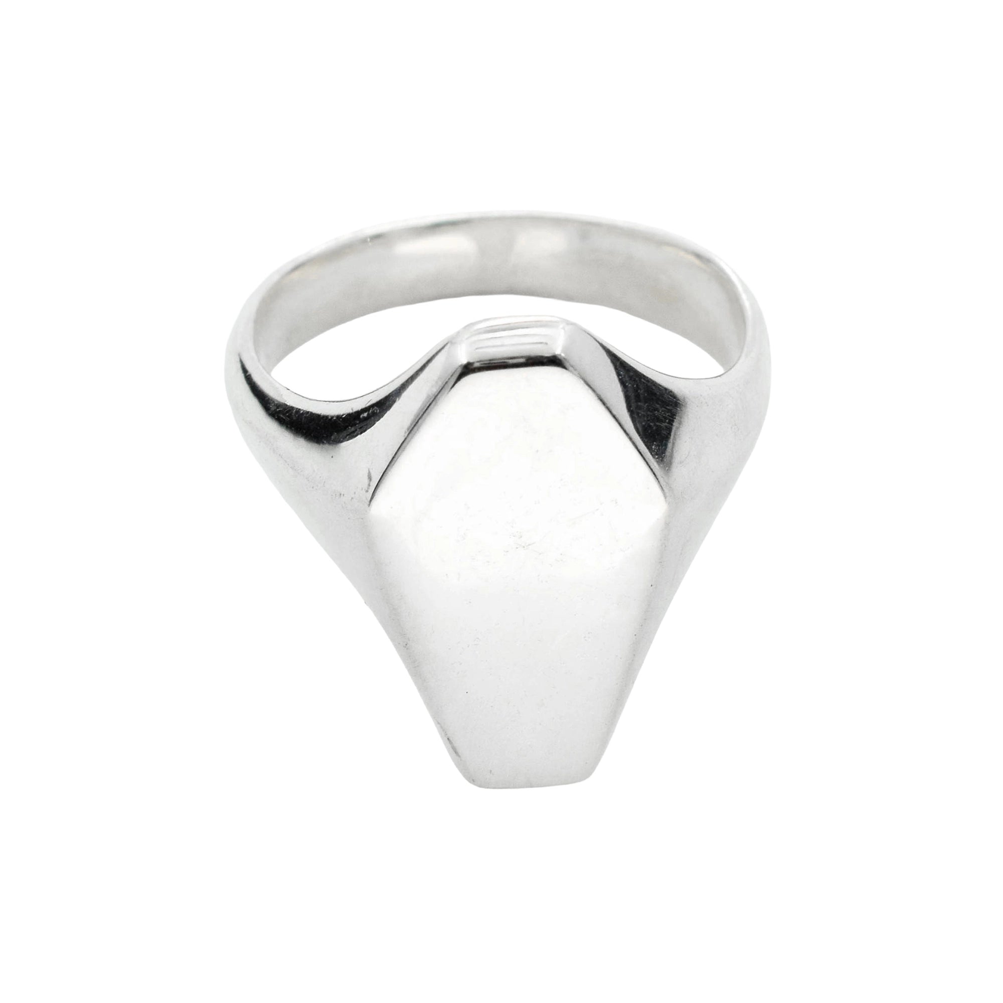 A silver signet ring with a geometric, faceted dome-shaped face and a polished band, shown against a plain white background.