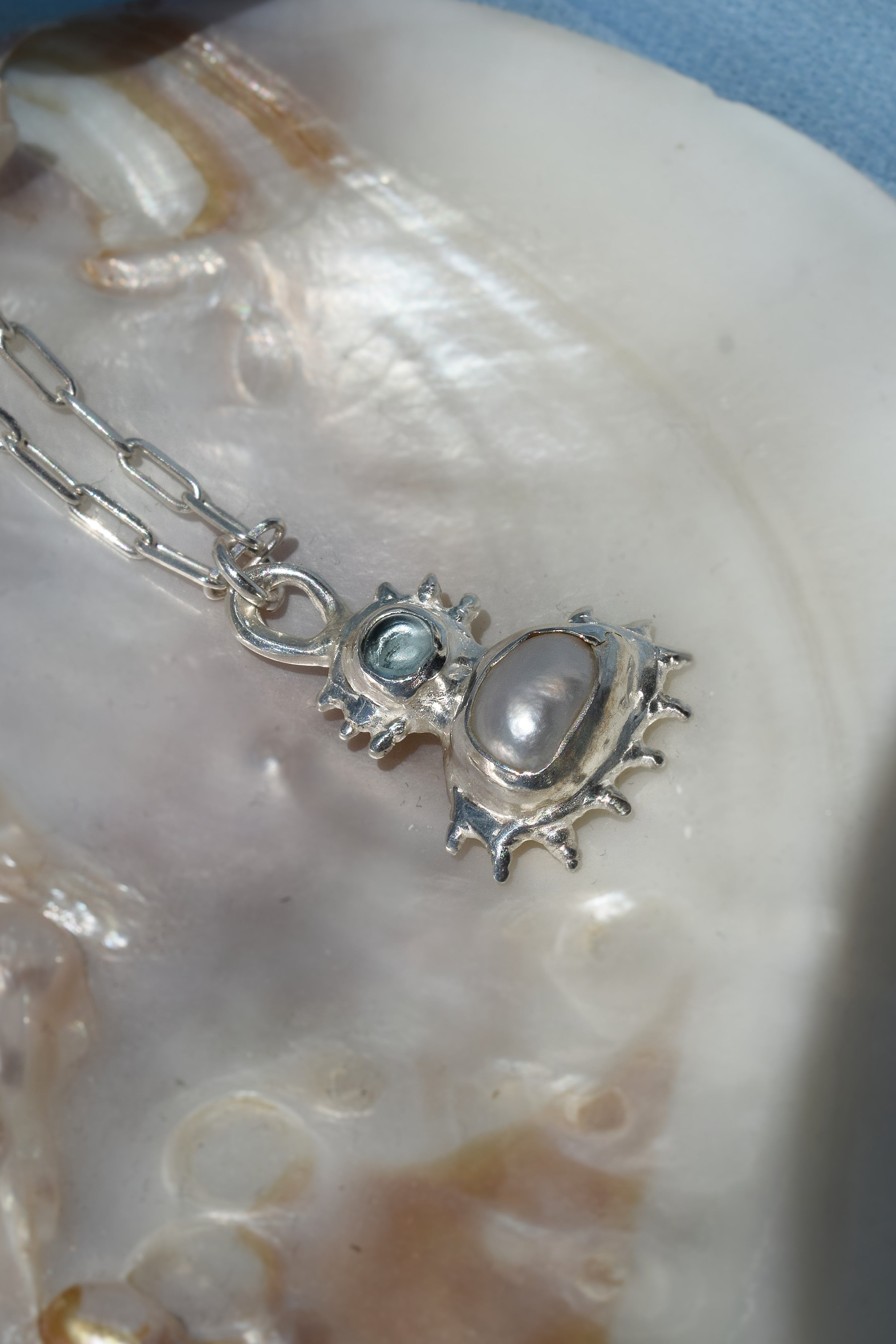 Coral inspired sterling silver pendant with blue topaz & freshwater pearl