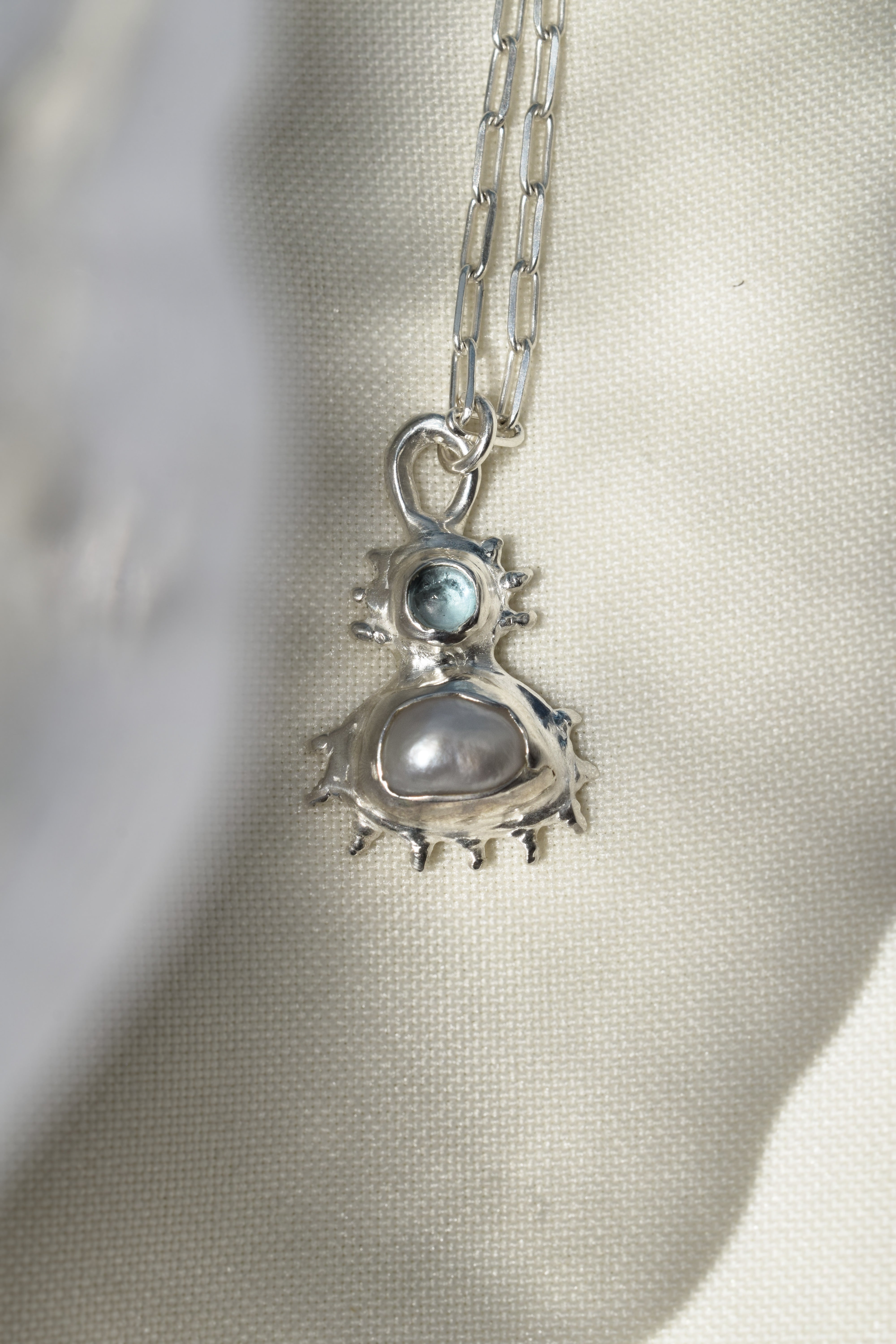 Coral inspired sterling silver pendant with blue topaz & freshwater pearl