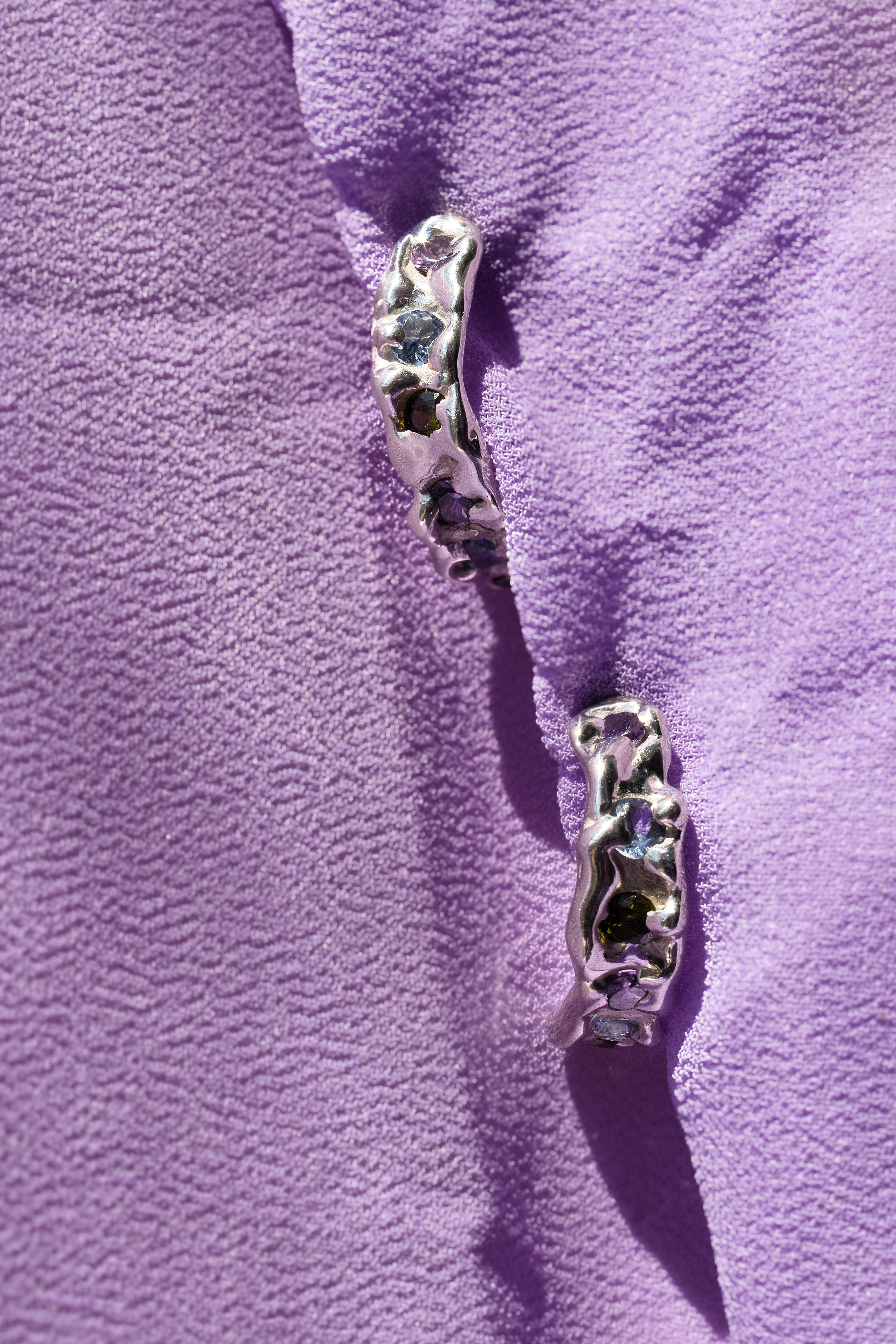Molten textured sterling silver hoops earrings with purple, blue and olive green cz crystals