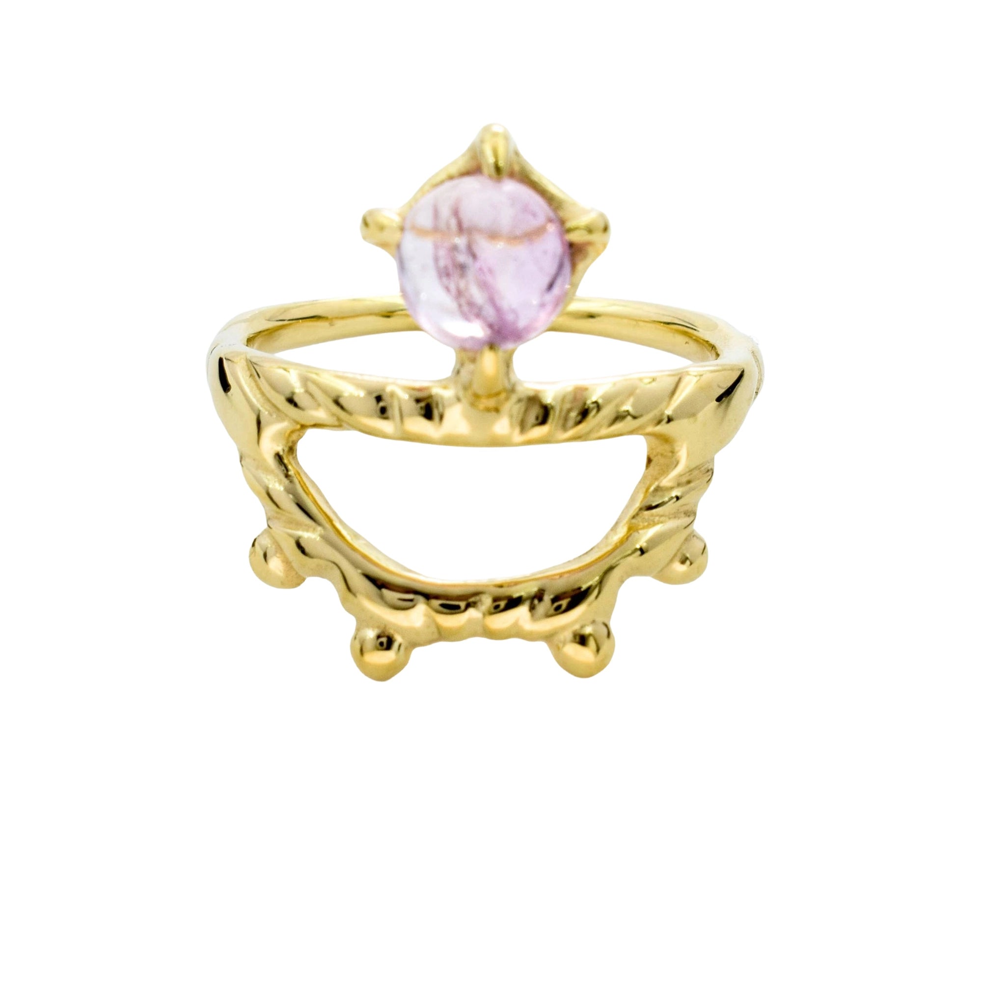 A gold ring featuring a twisted, open arch band with a central bezel-set light purple oval gemstone, shown on a plain white background.