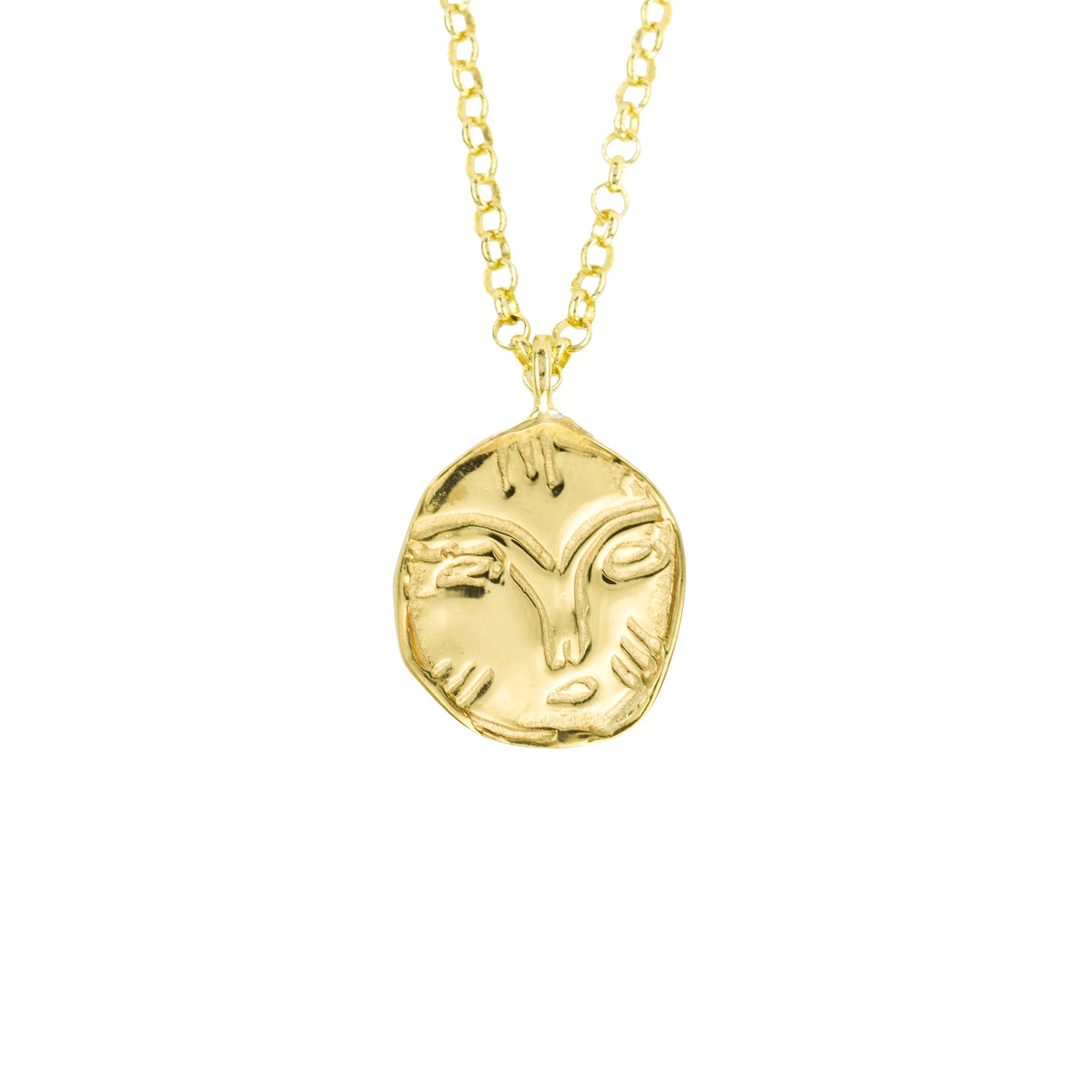 A gold pendant necklace featuring a stylized, textured ram's head design on a delicate gold chain, set against a plain white background.