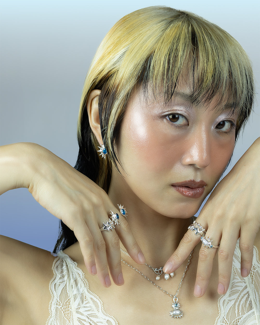 Double sunburst cuff ring with blue cz crystals