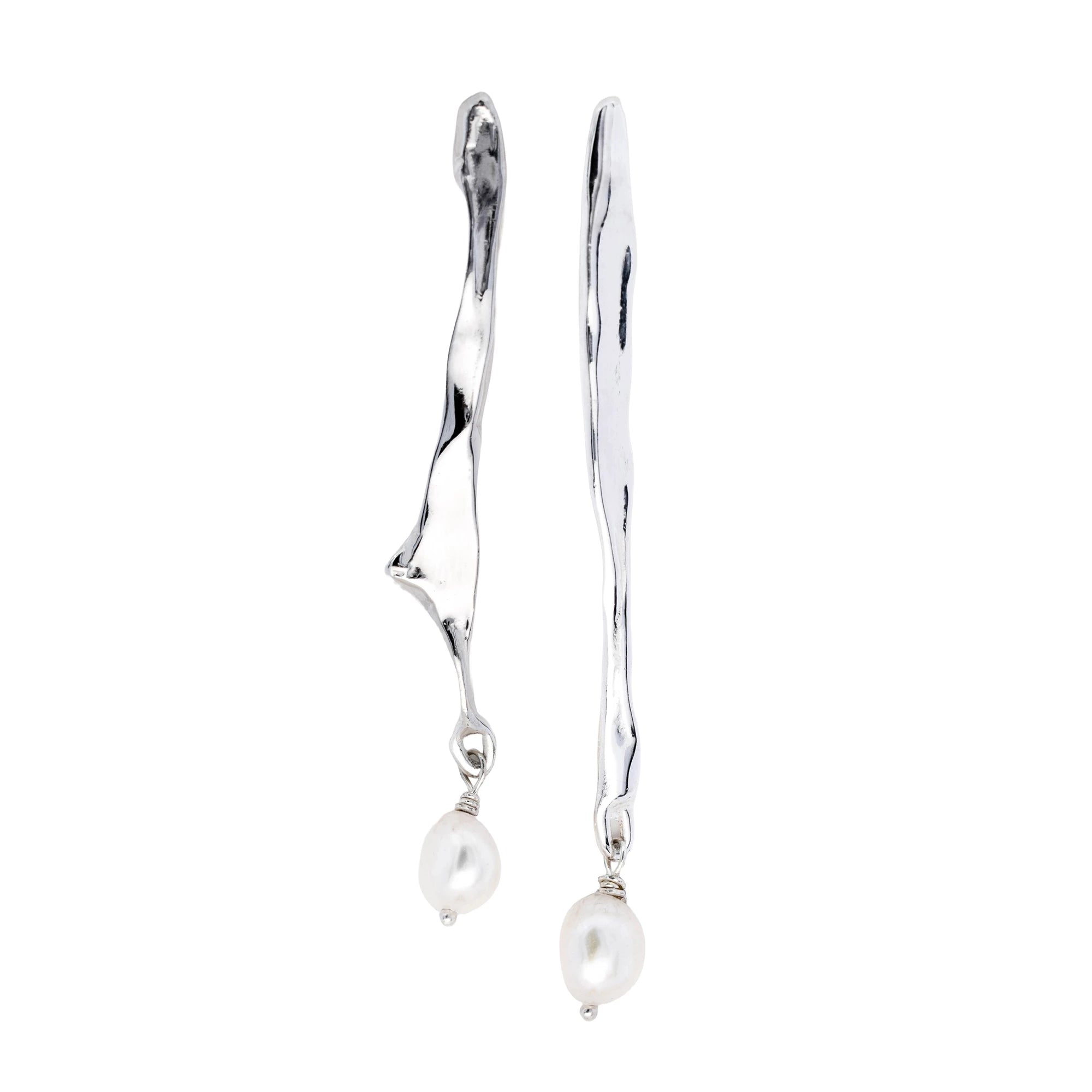 A pair of silver dangle earrings with organic, wavy branches and hanging white baroque pearls, shown against a plain white background.