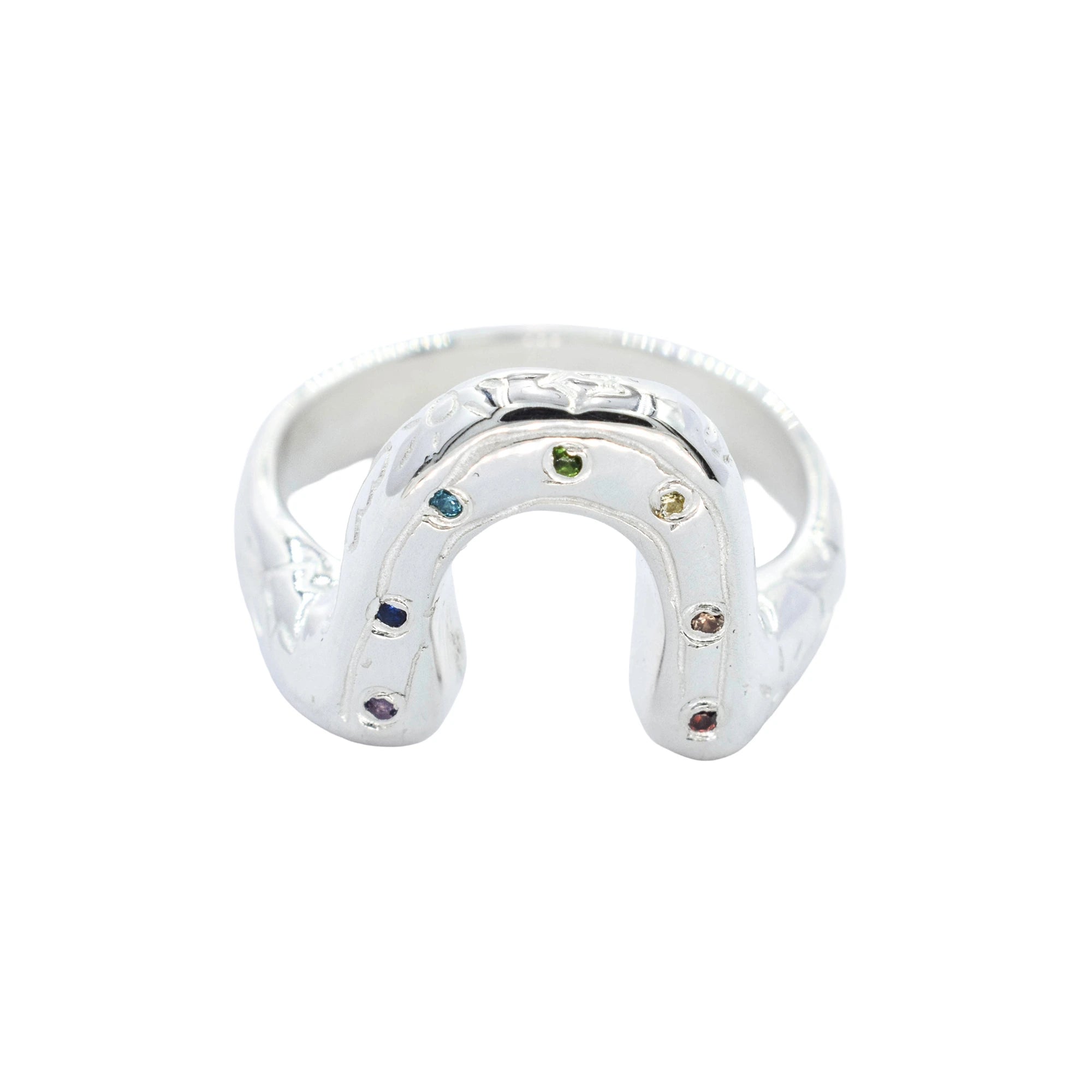 Silver ring shaped like a horseshoe with embedded stones on a white background