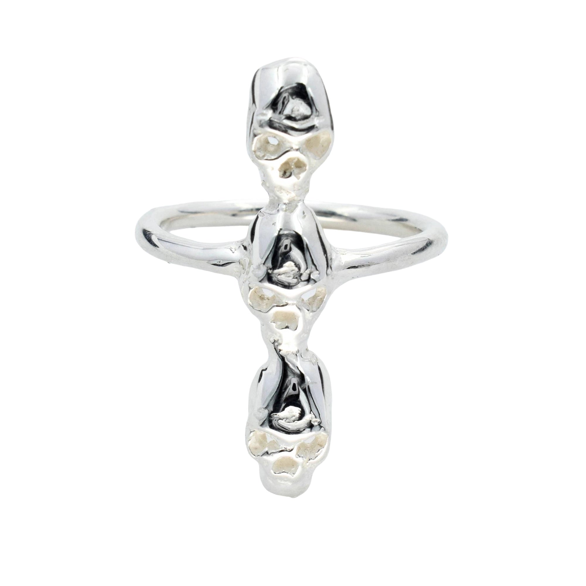 A silver ring featuring three stacked, stylized human figures with skull faces, set against a plain white background.