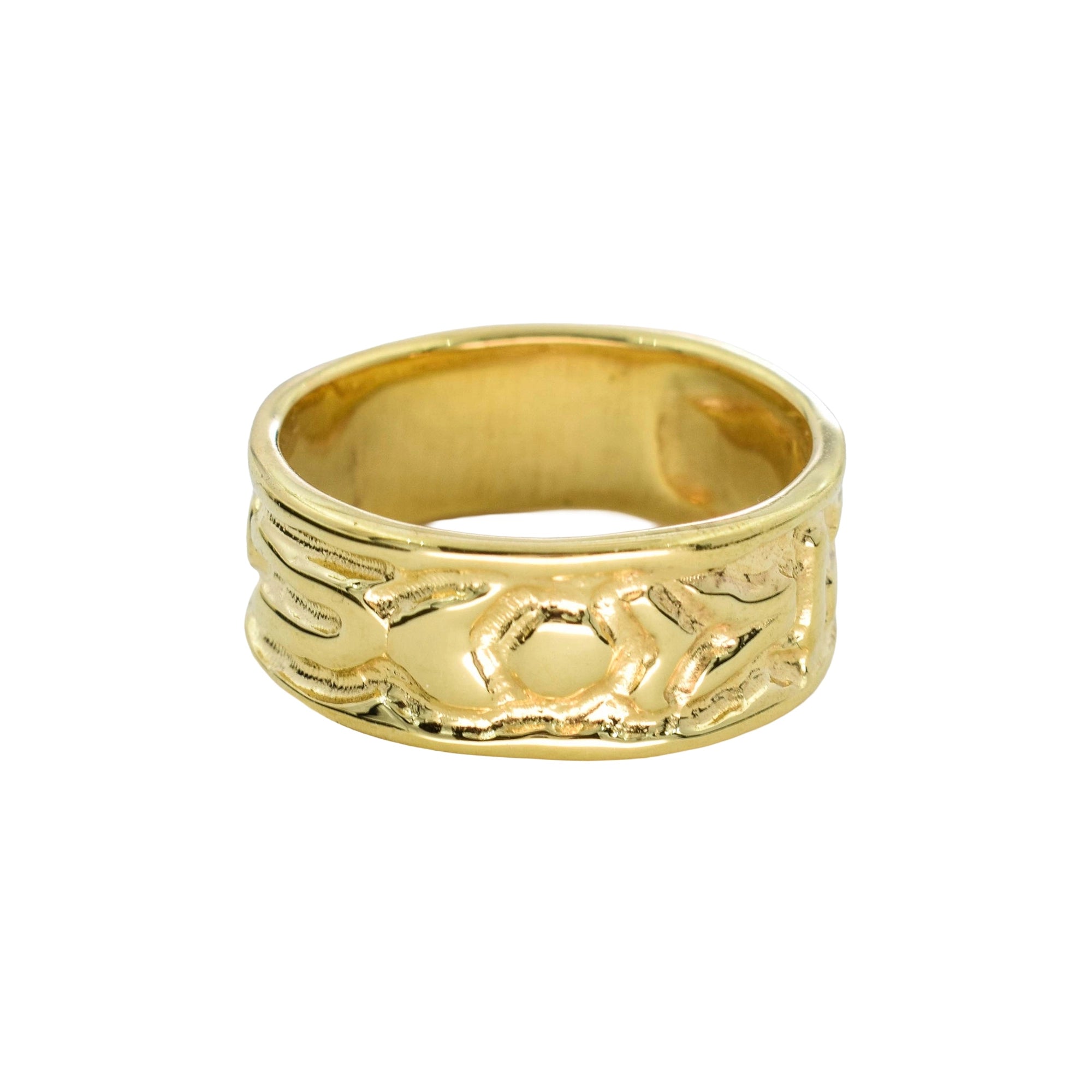 A gold band ring with a textured, organic, wavy pattern on the outer surface, shown against a plain white background.