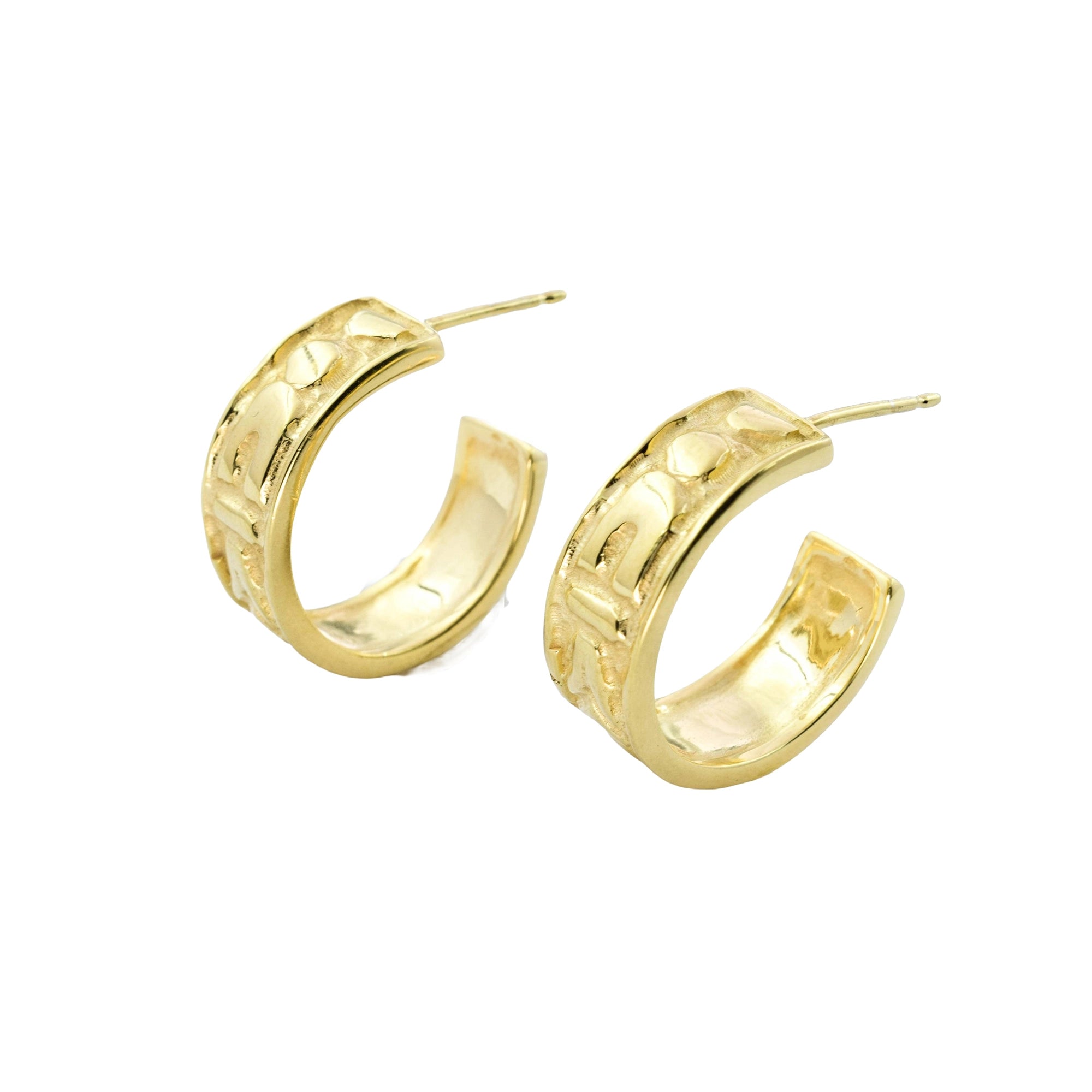 A pair of gold huggie hoop earrings with a textured, hammered finish and post-back closures, shown on a plain white background.