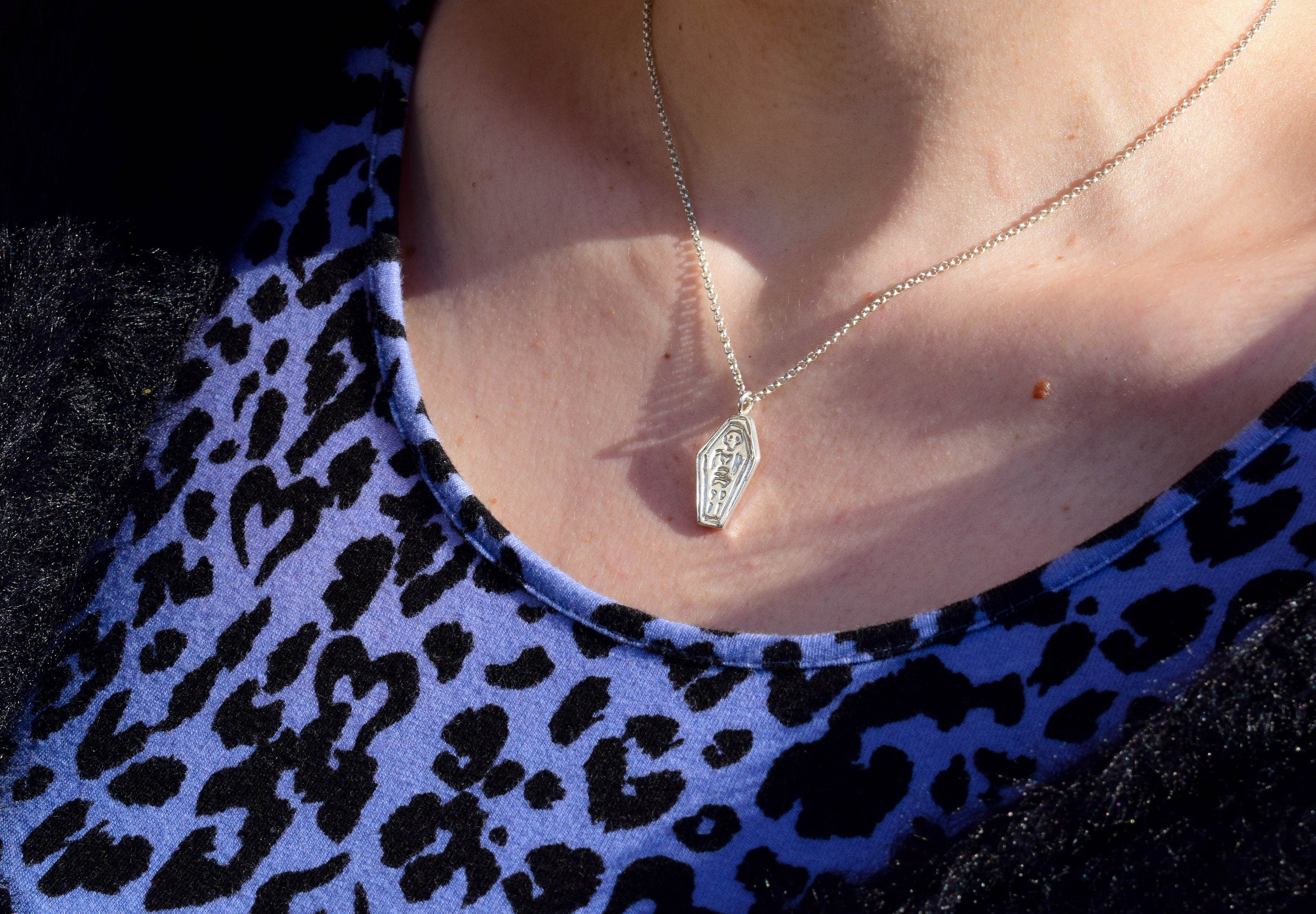 Skeleton in a coffin necklace