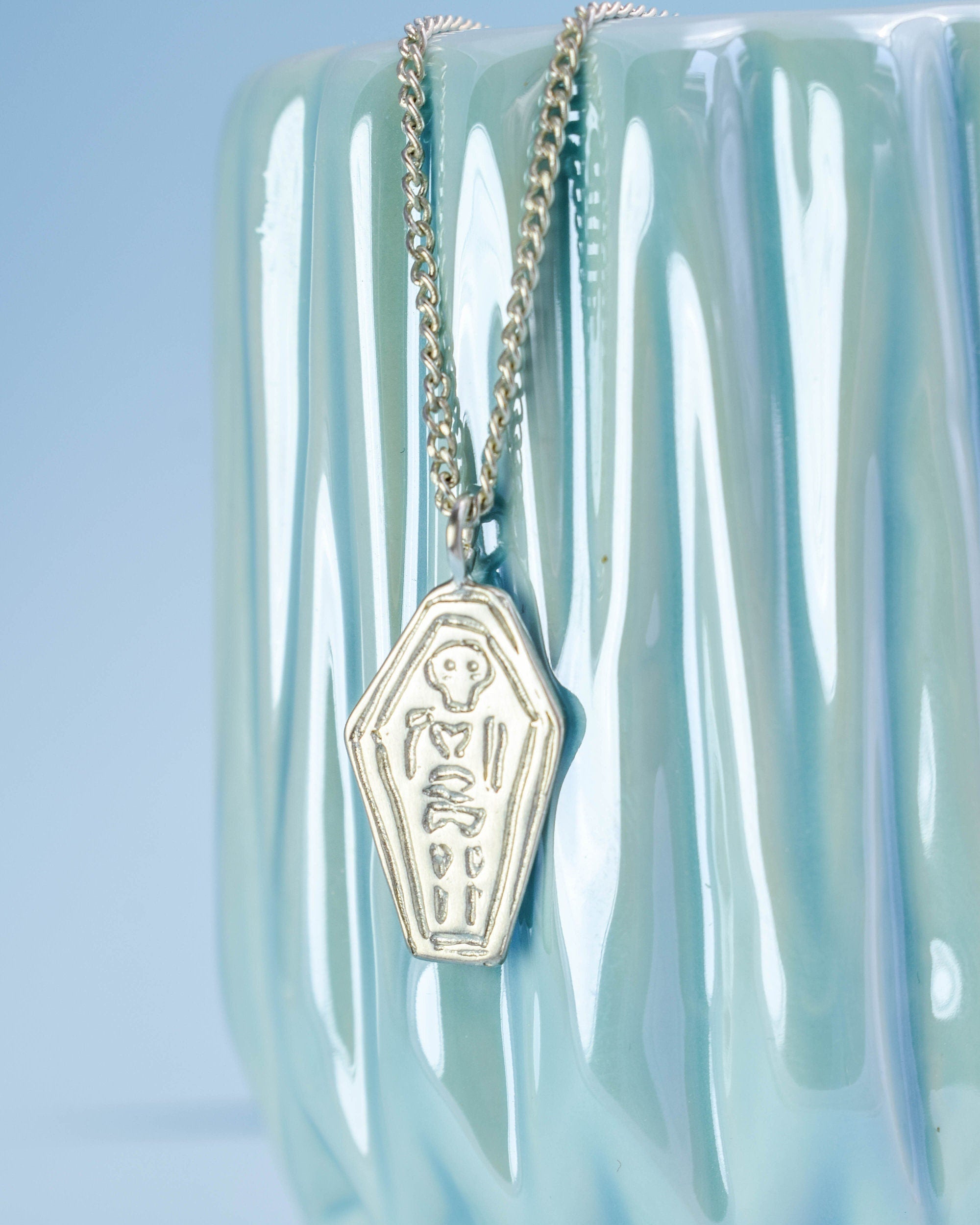 Skeleton in a coffin necklace