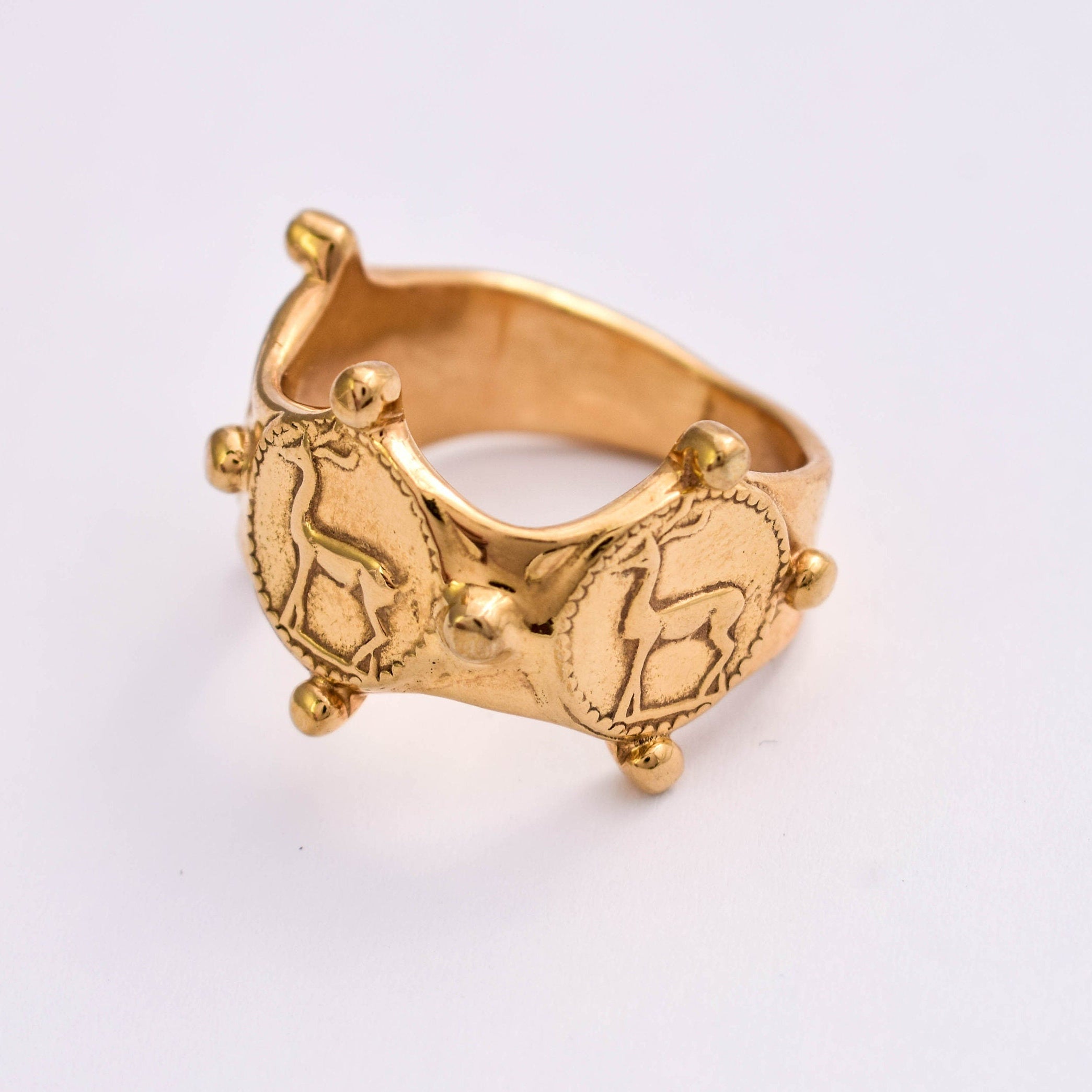 Wide gold tone deer ring