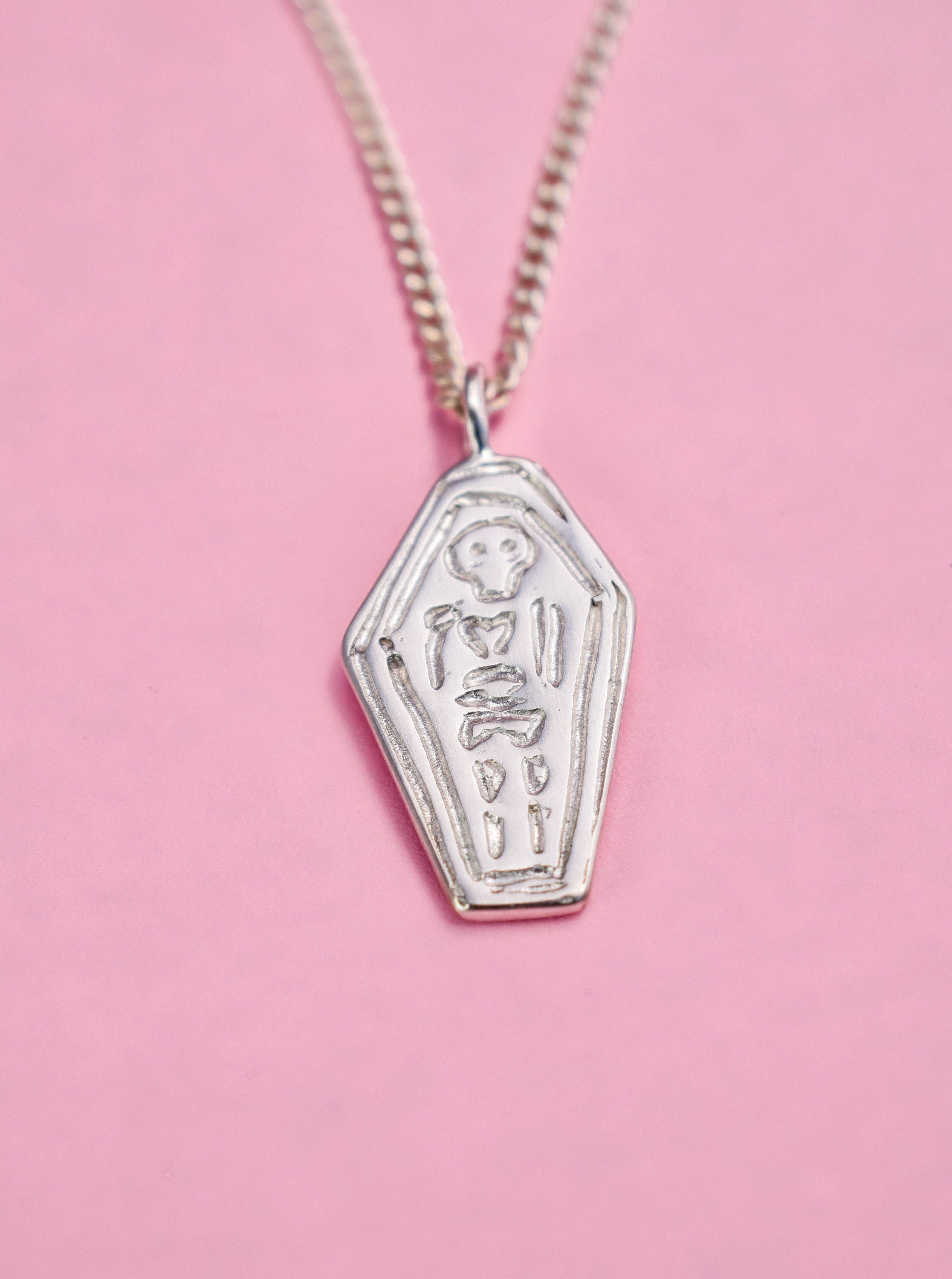 Skeleton in a coffin necklace