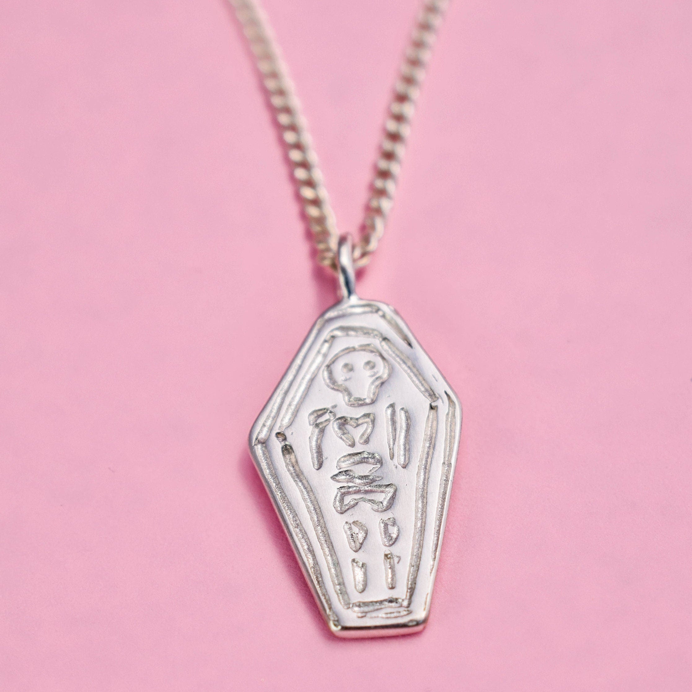 Skeleton in a coffin necklace