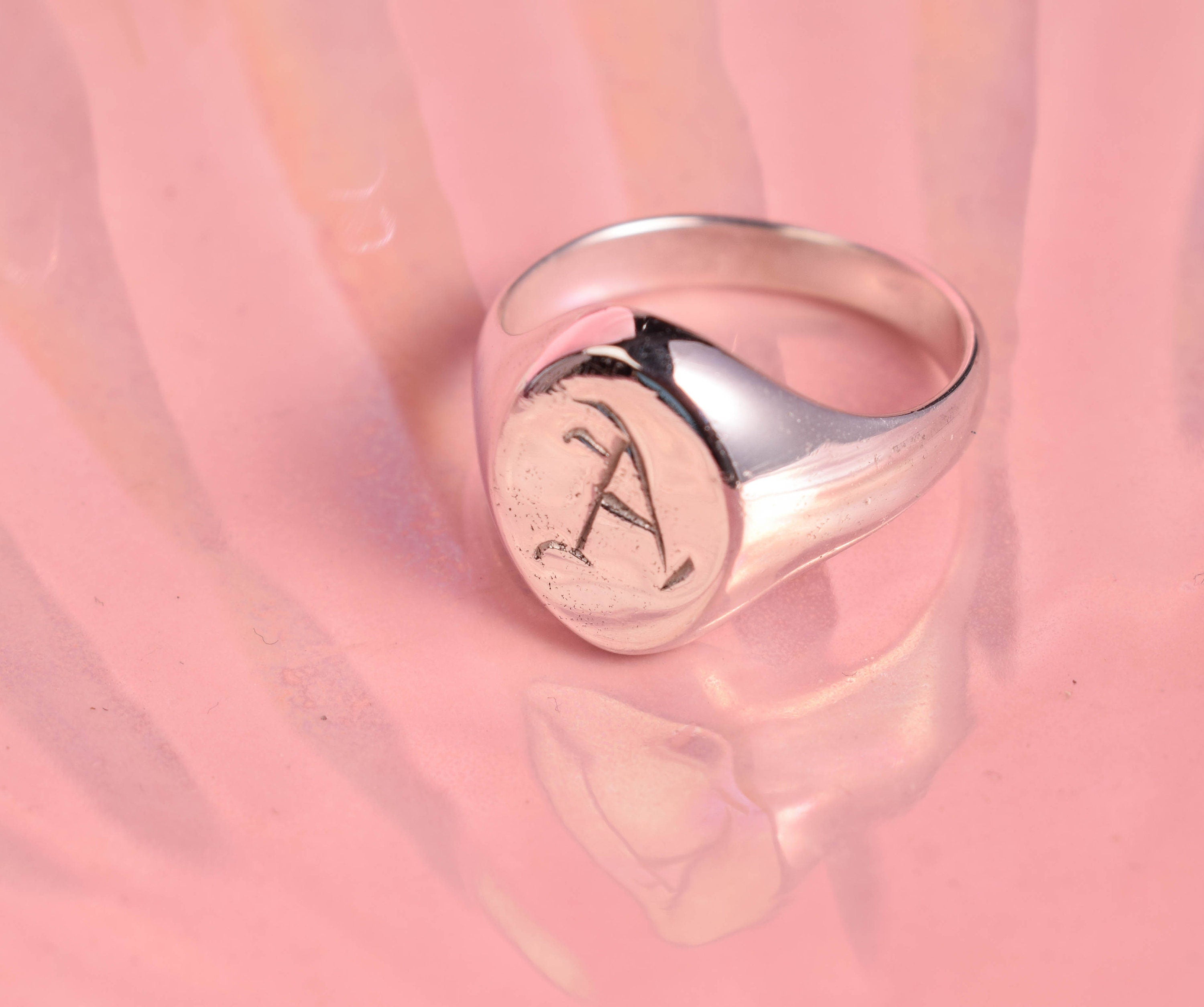 Oval signet ring with hand carved initials in Old English font