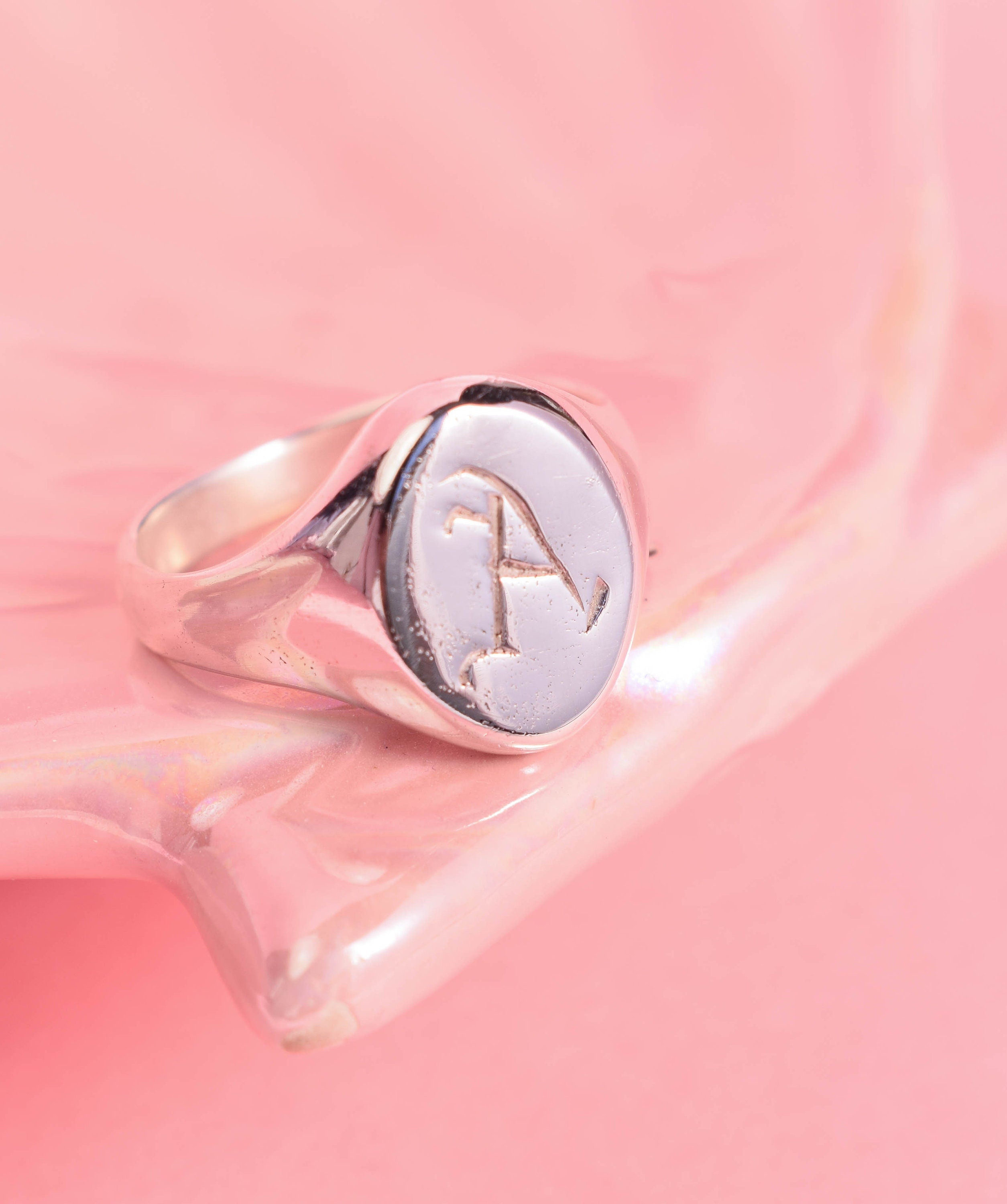 Oval signet ring with hand carved initials in Old English font
