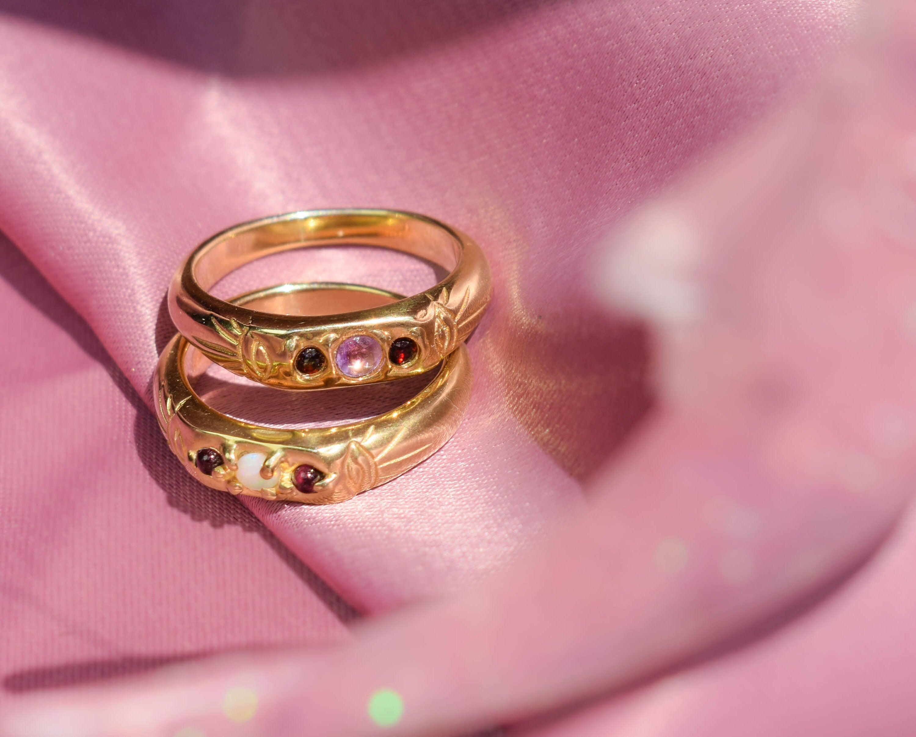 Opal and garnet thin band ring with evil eyes