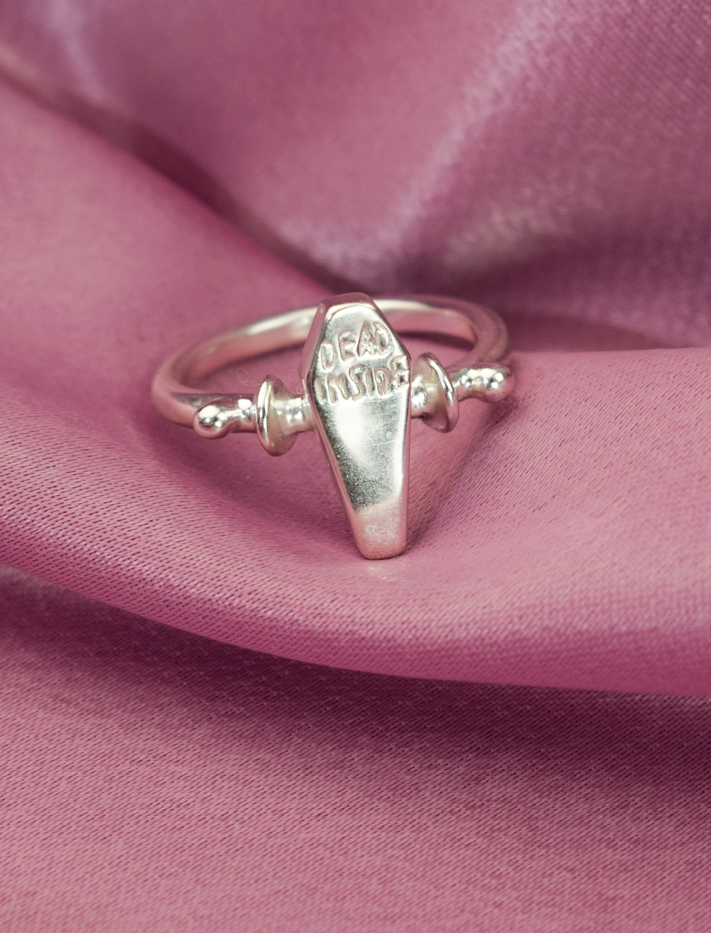 Dead inside coffin ring