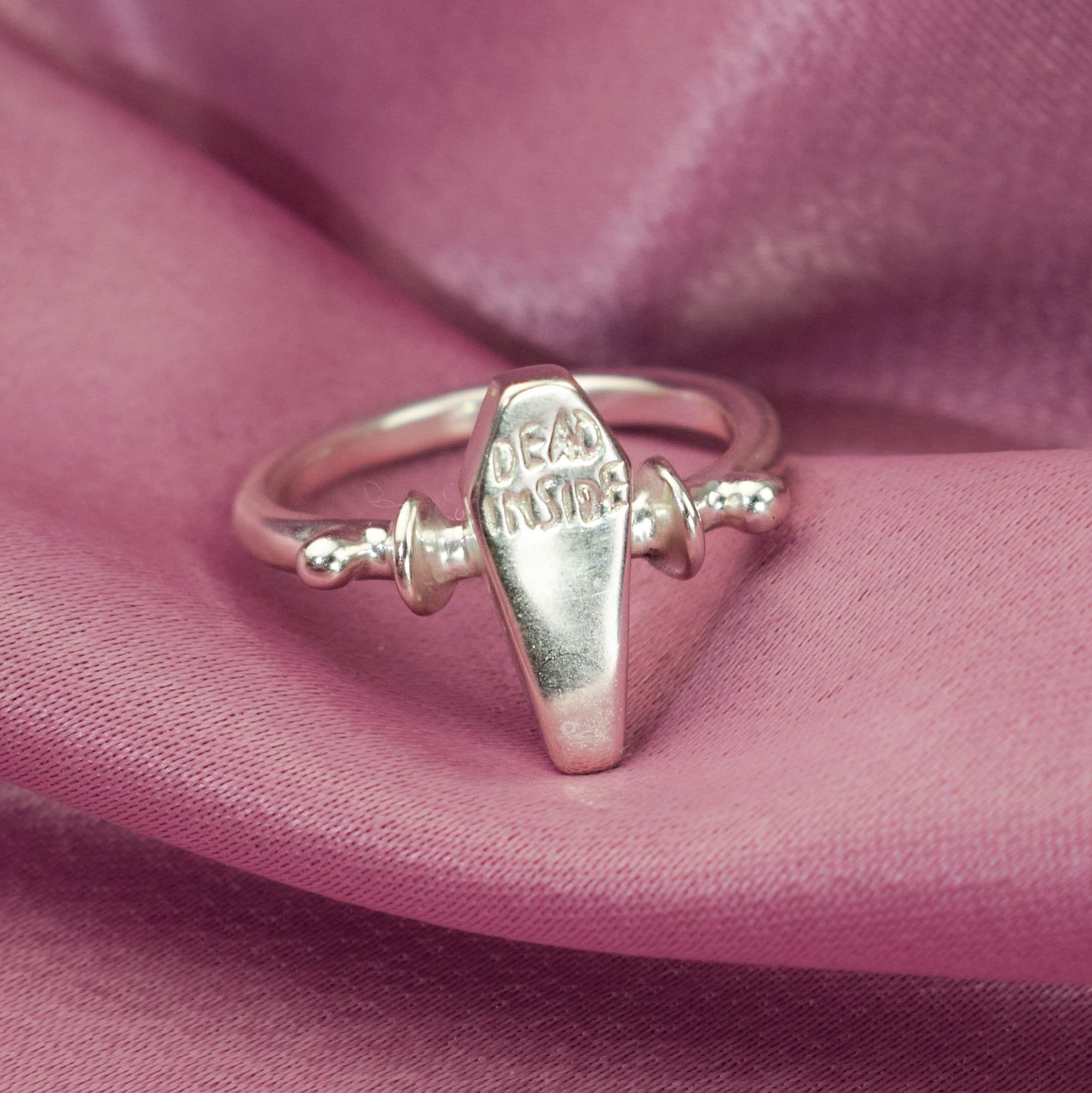 Dead inside coffin ring
