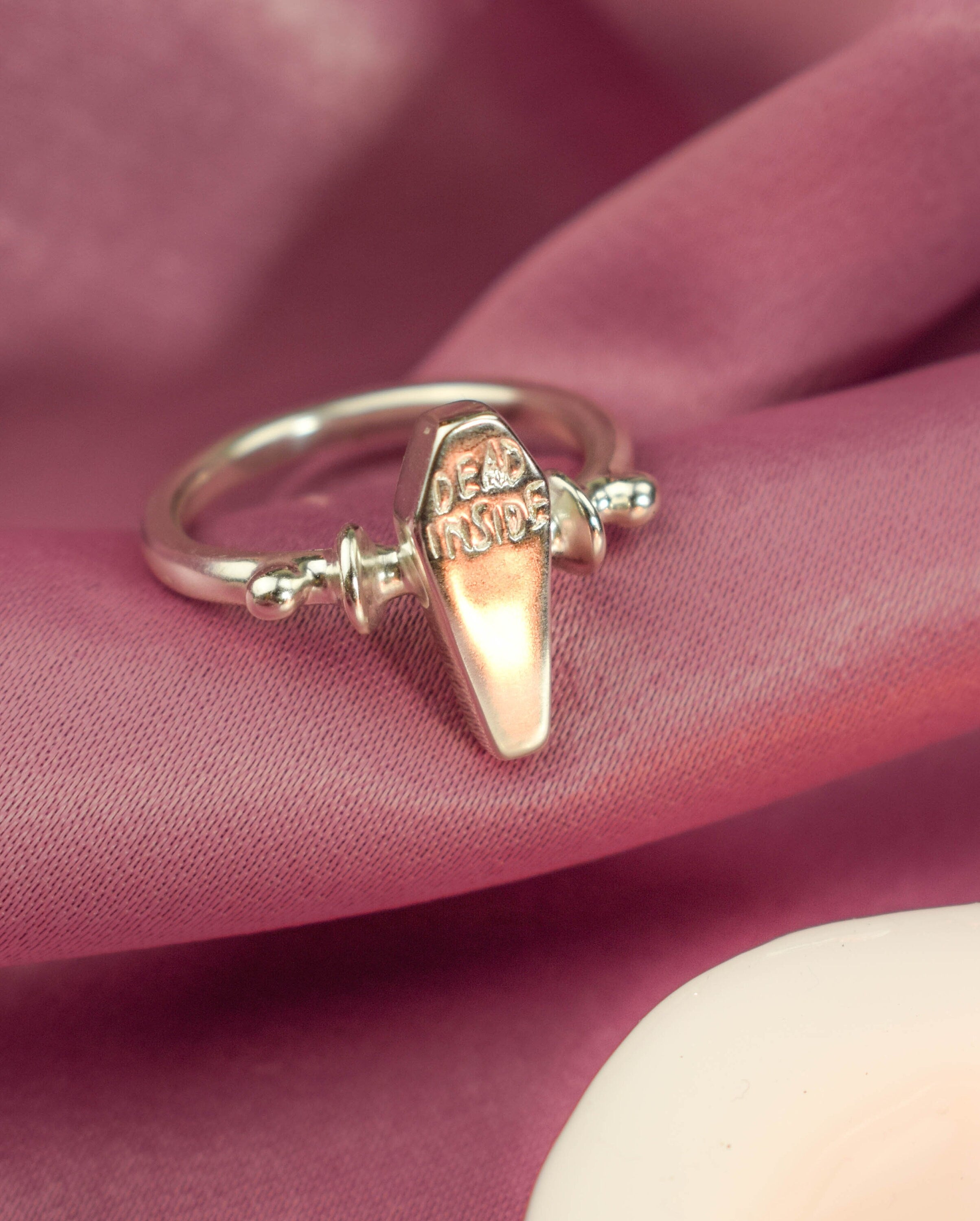 Dead inside coffin ring
