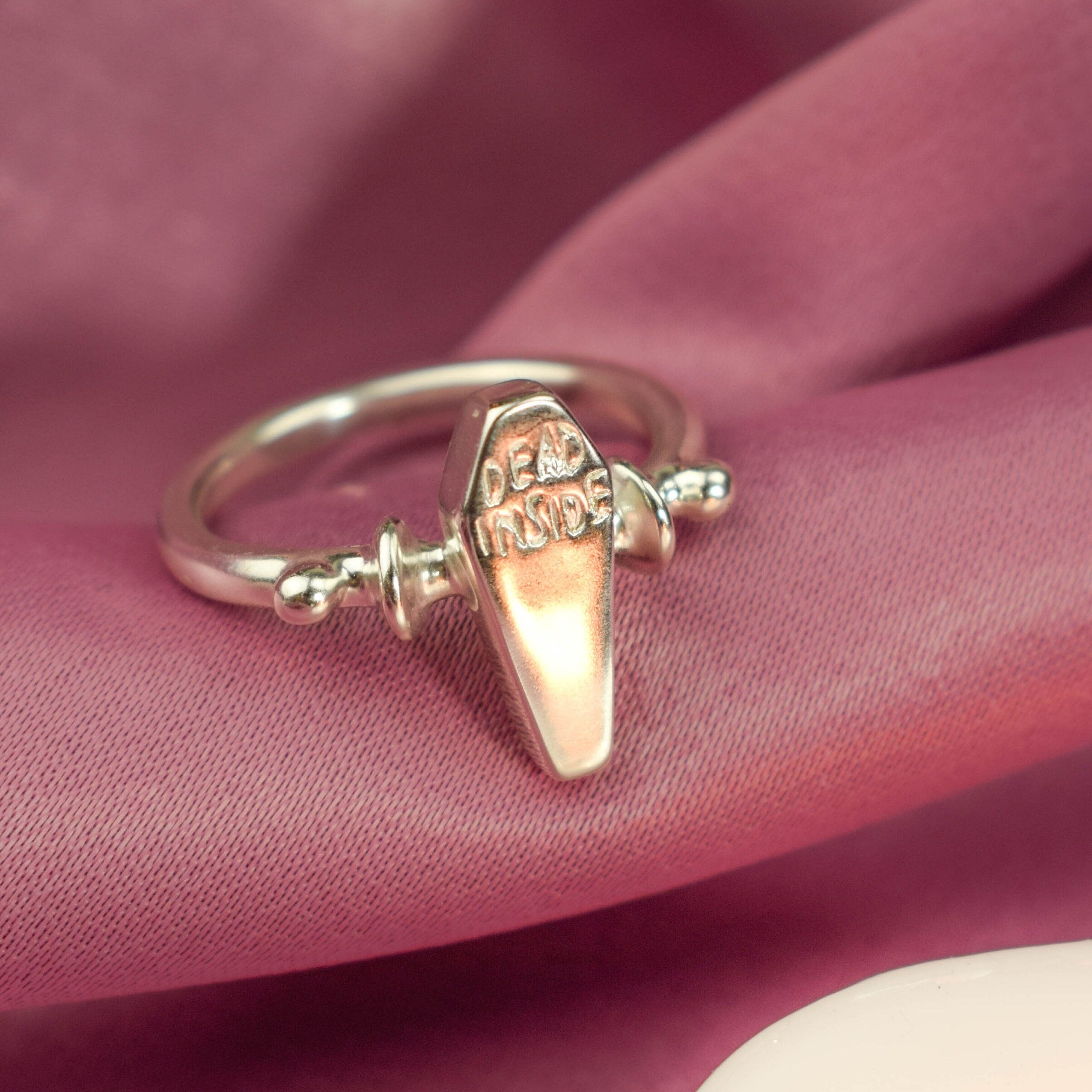 Dead inside coffin ring