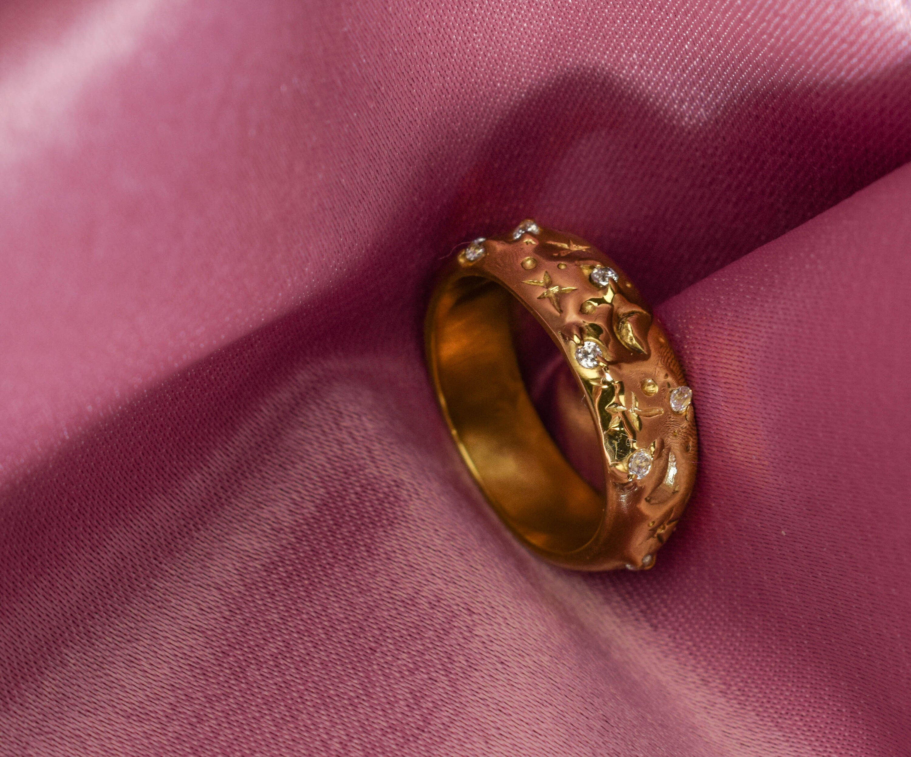 Wide band rings with clear crystals