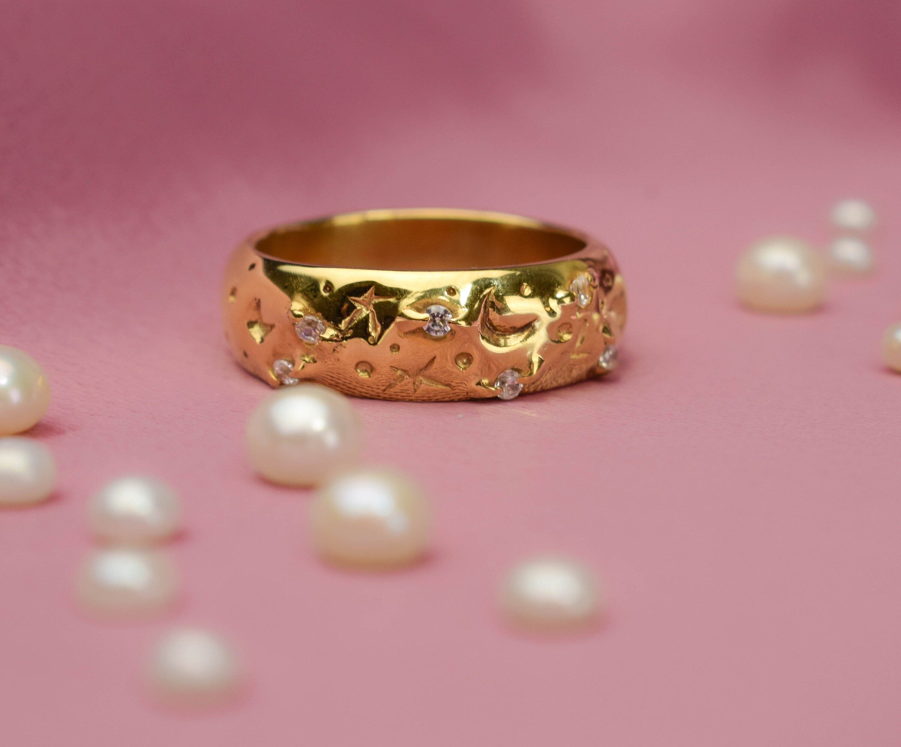 Wide band rings with clear crystals