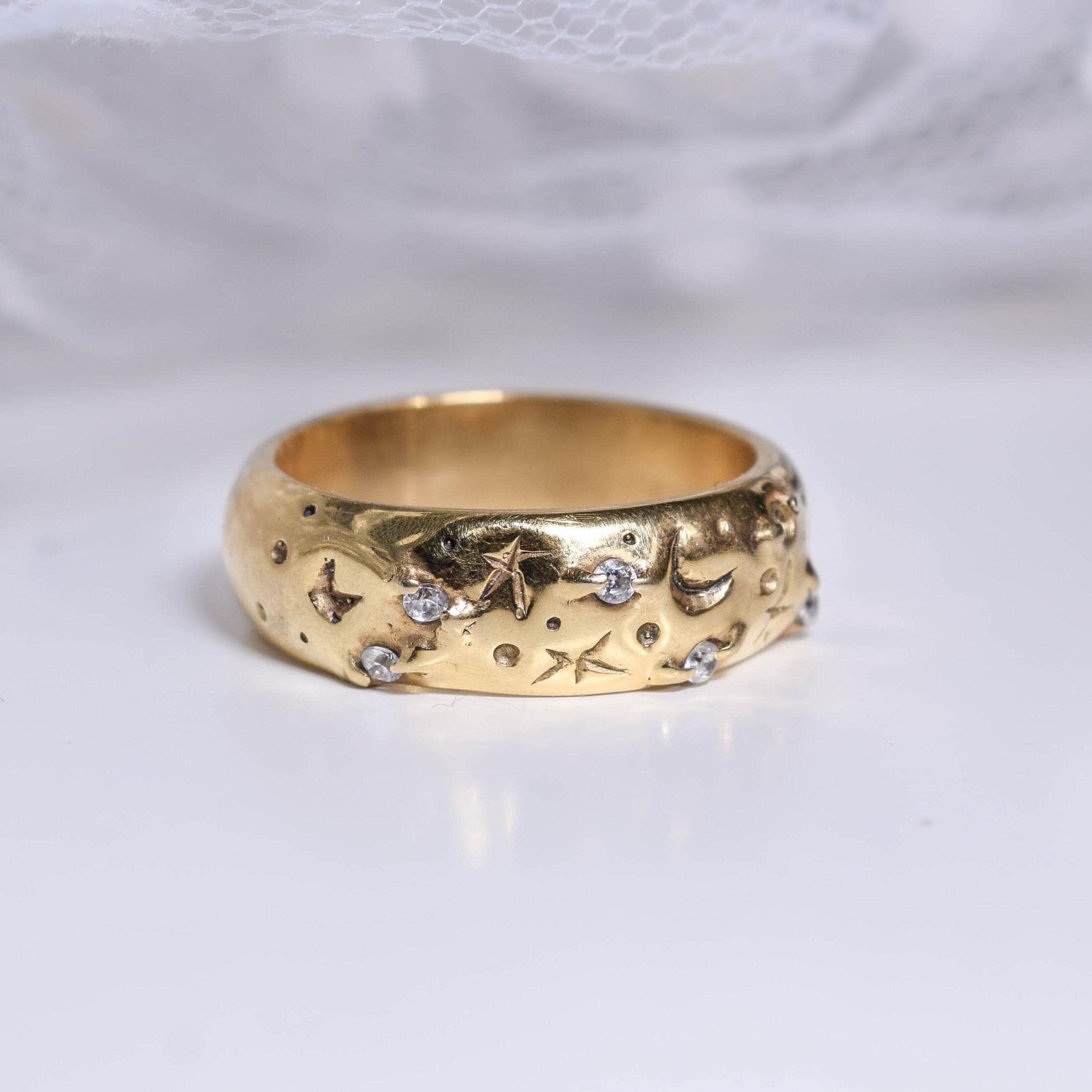 Wide band rings with clear crystals