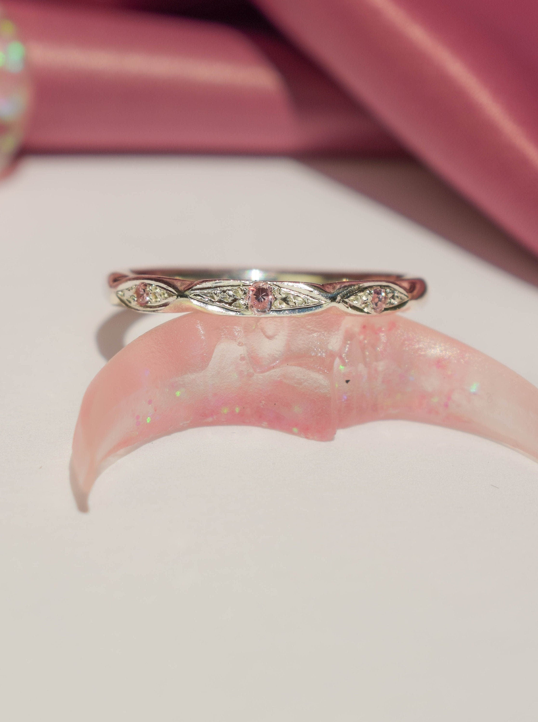 Thin silver ring with pink cz crystals