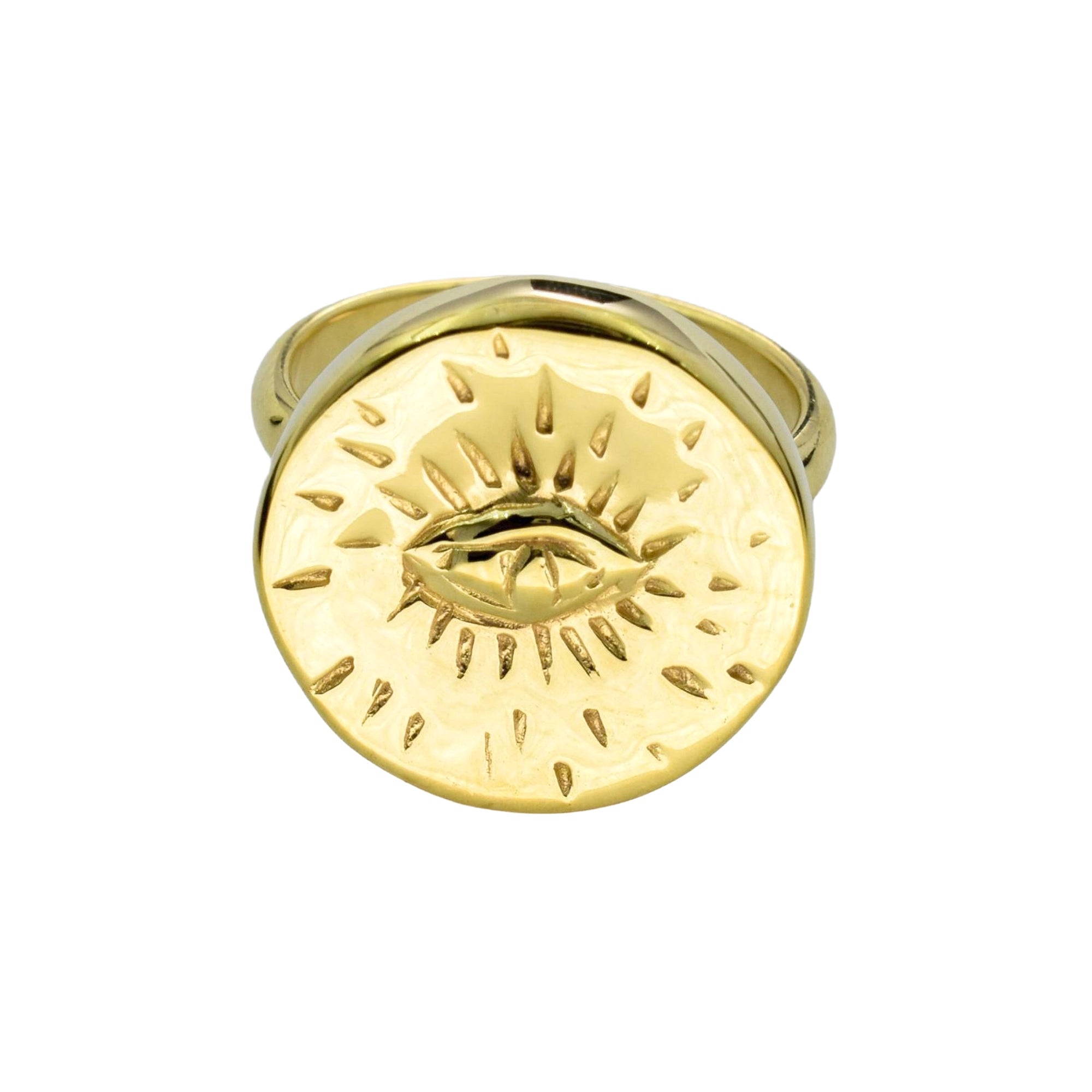 A gold-toned signet ring featuring a raised circular face with an eye surrounded by radiating sunburst lines, shown on a plain white background.