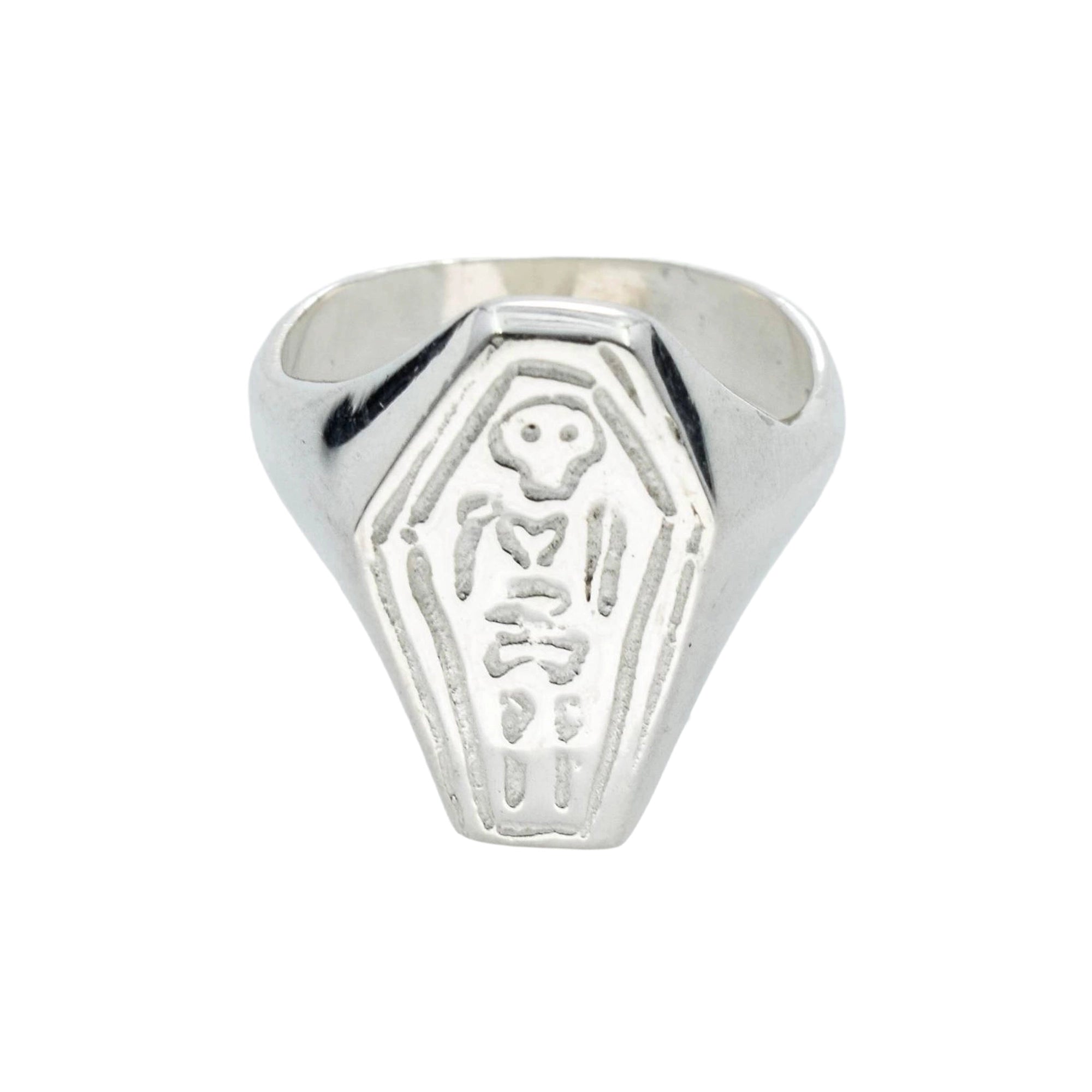 A silver coffin-shaped signet ring featuring an embossed skeleton design on the front, set against a plain white background.