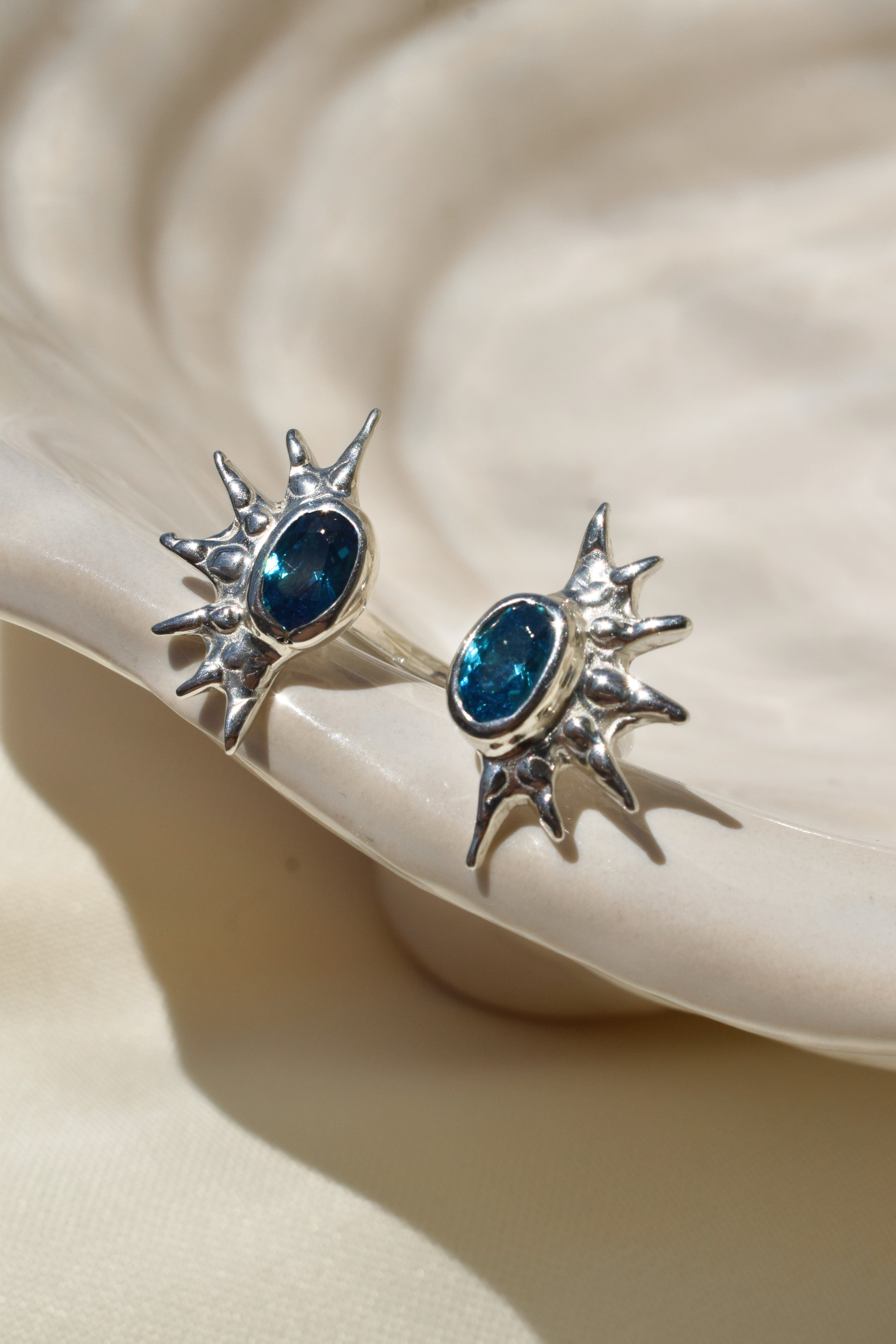 Double sunburst cuff ring with blue cz crystals