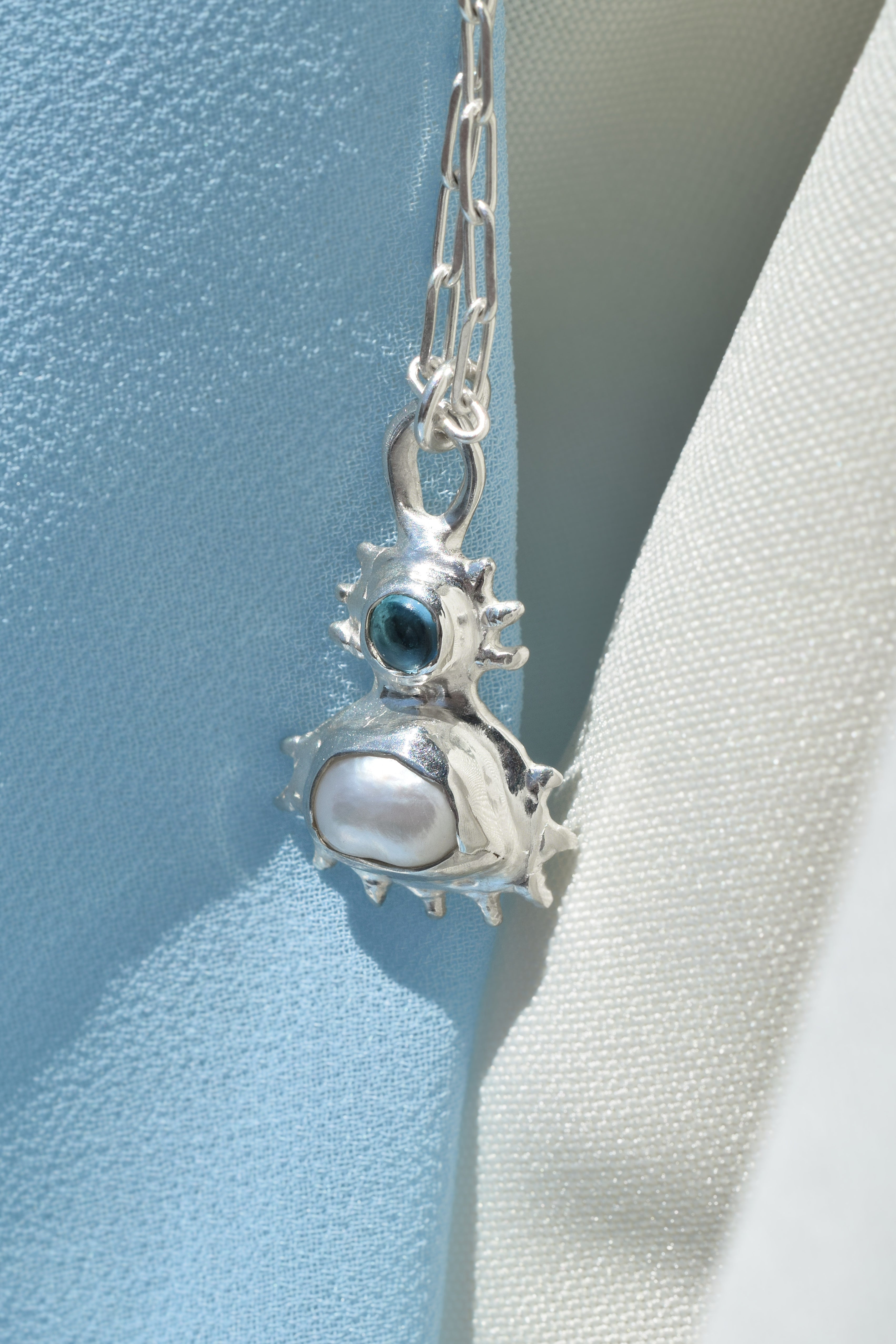 Coral inspired sterling silver pendant with blue topaz & freshwater pearl