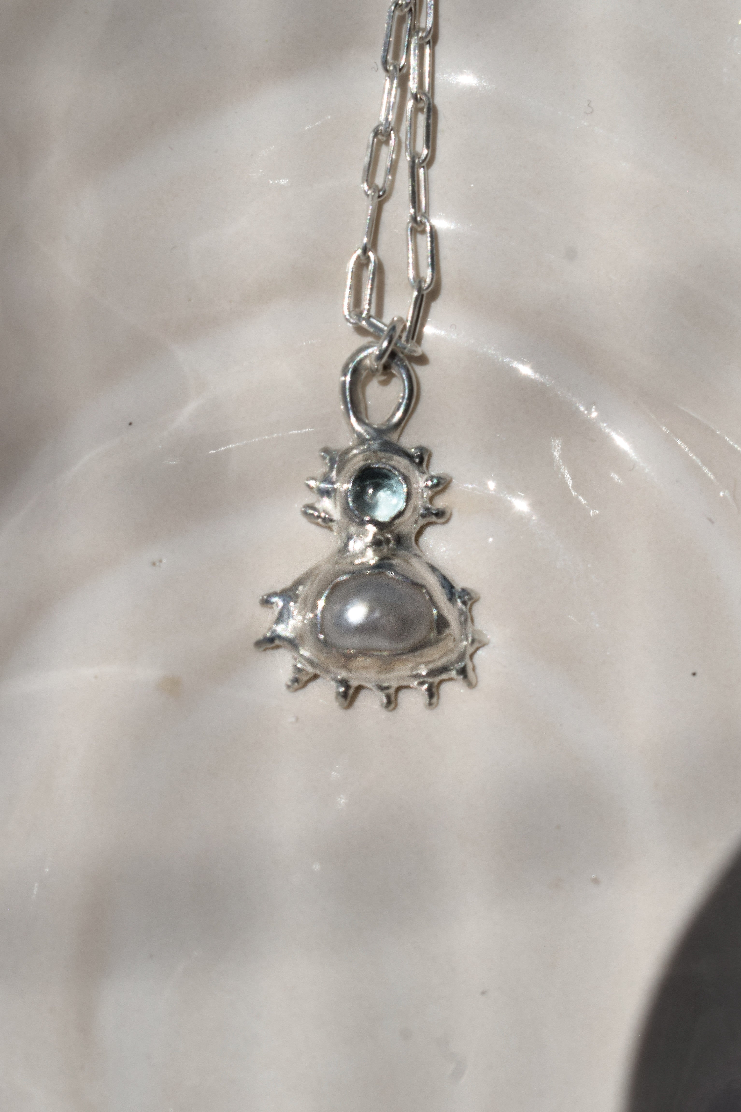 Coral inspired sterling silver pendant with blue topaz & freshwater pearl
