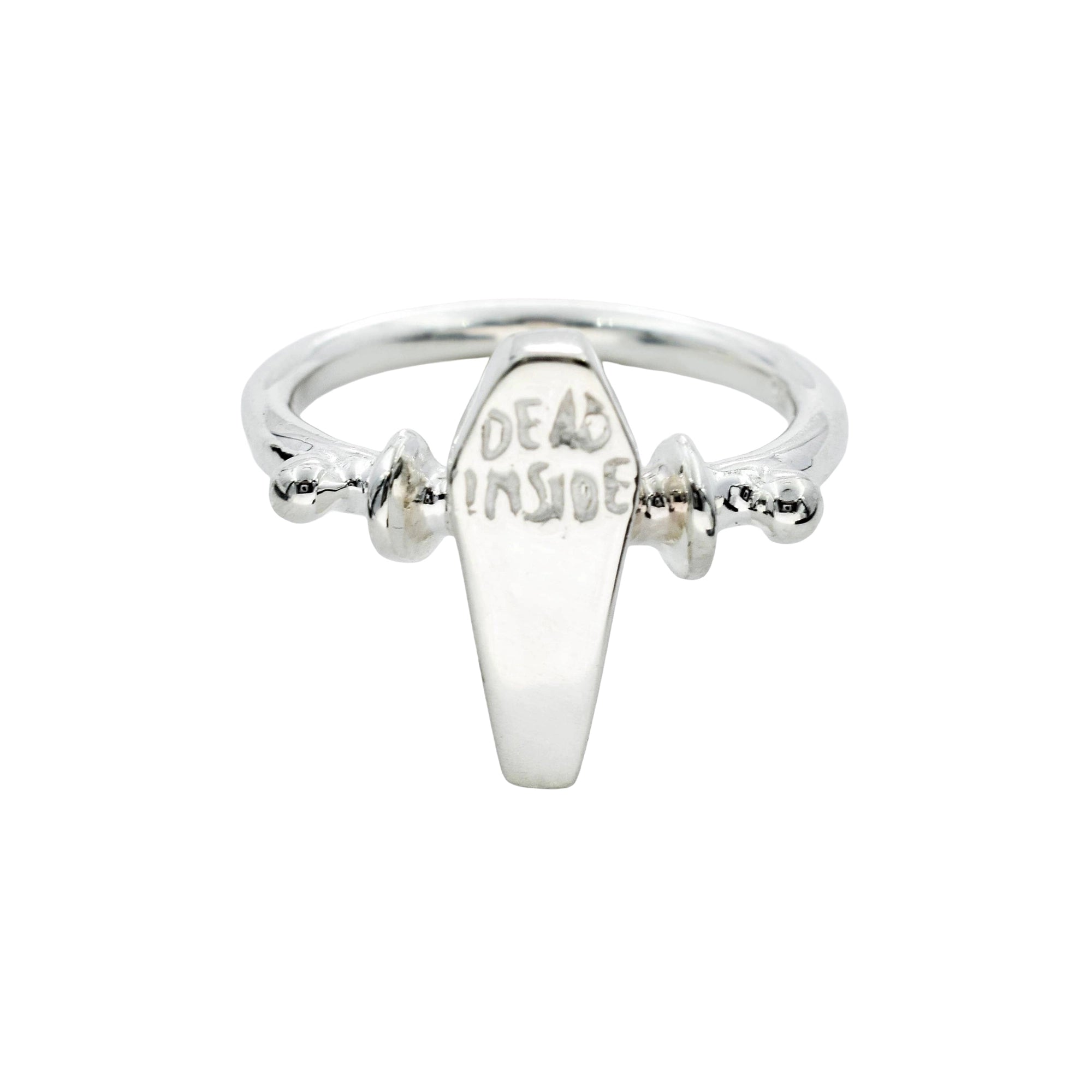 A silver coffin-shaped ring with 'DEAD INSIDE' engraved on the front, set against a plain white background.