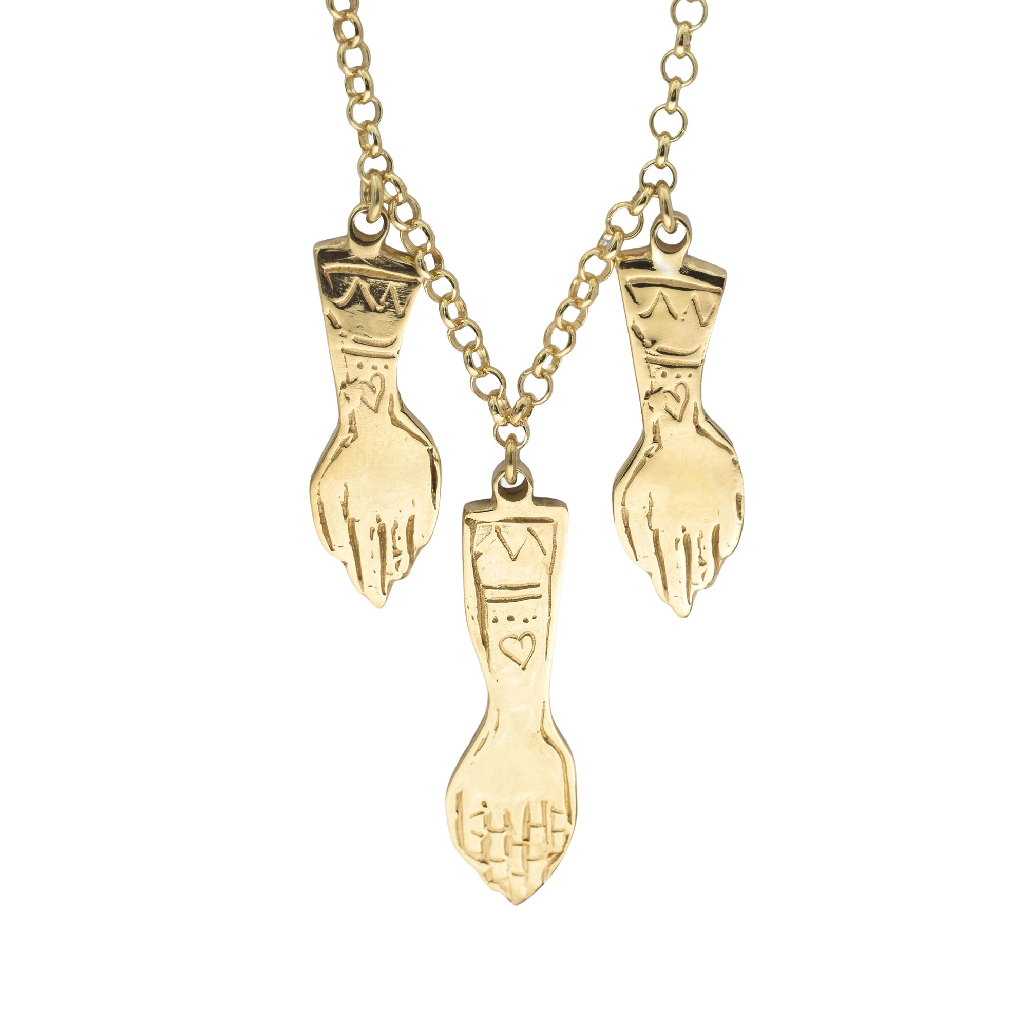 A gold-tone chain necklace featuring three hand-shaped pendants with engraved tribal-style patterns and small heart details, shown against a plain white background.