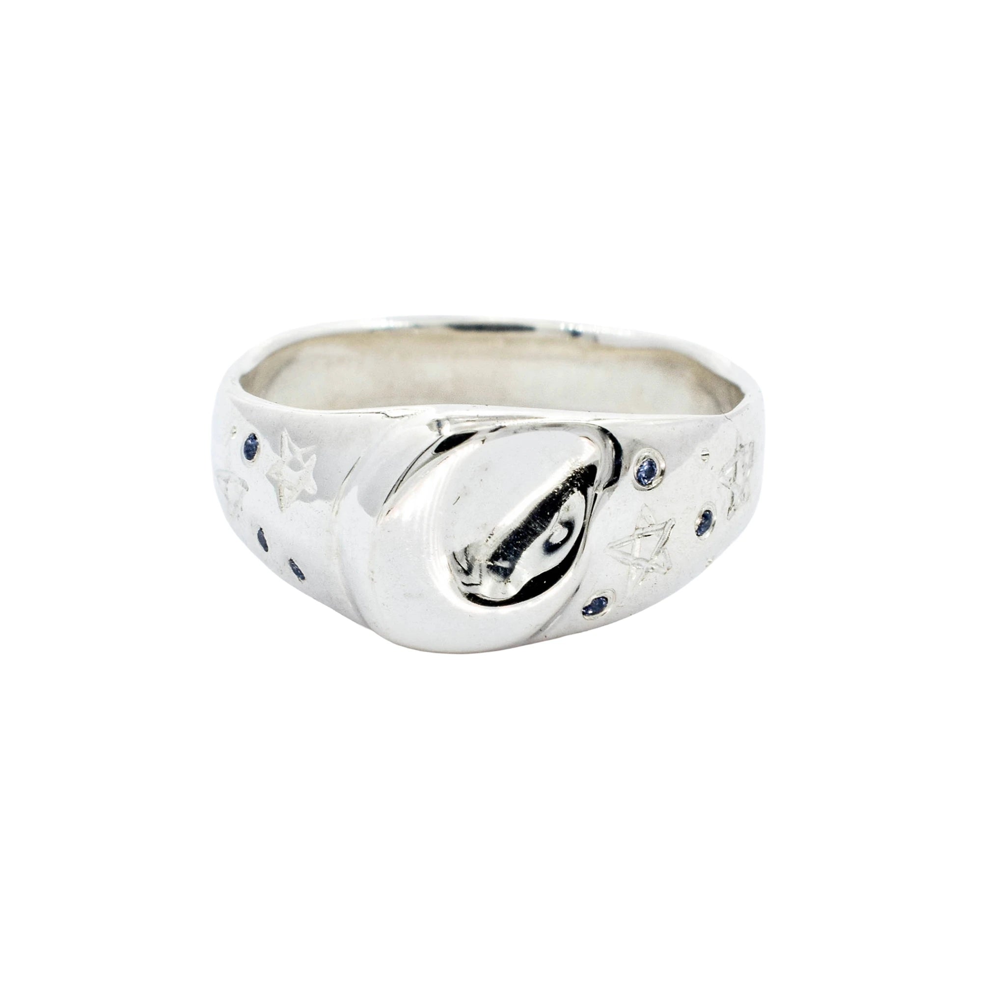Silver ring with engraved design on a white background