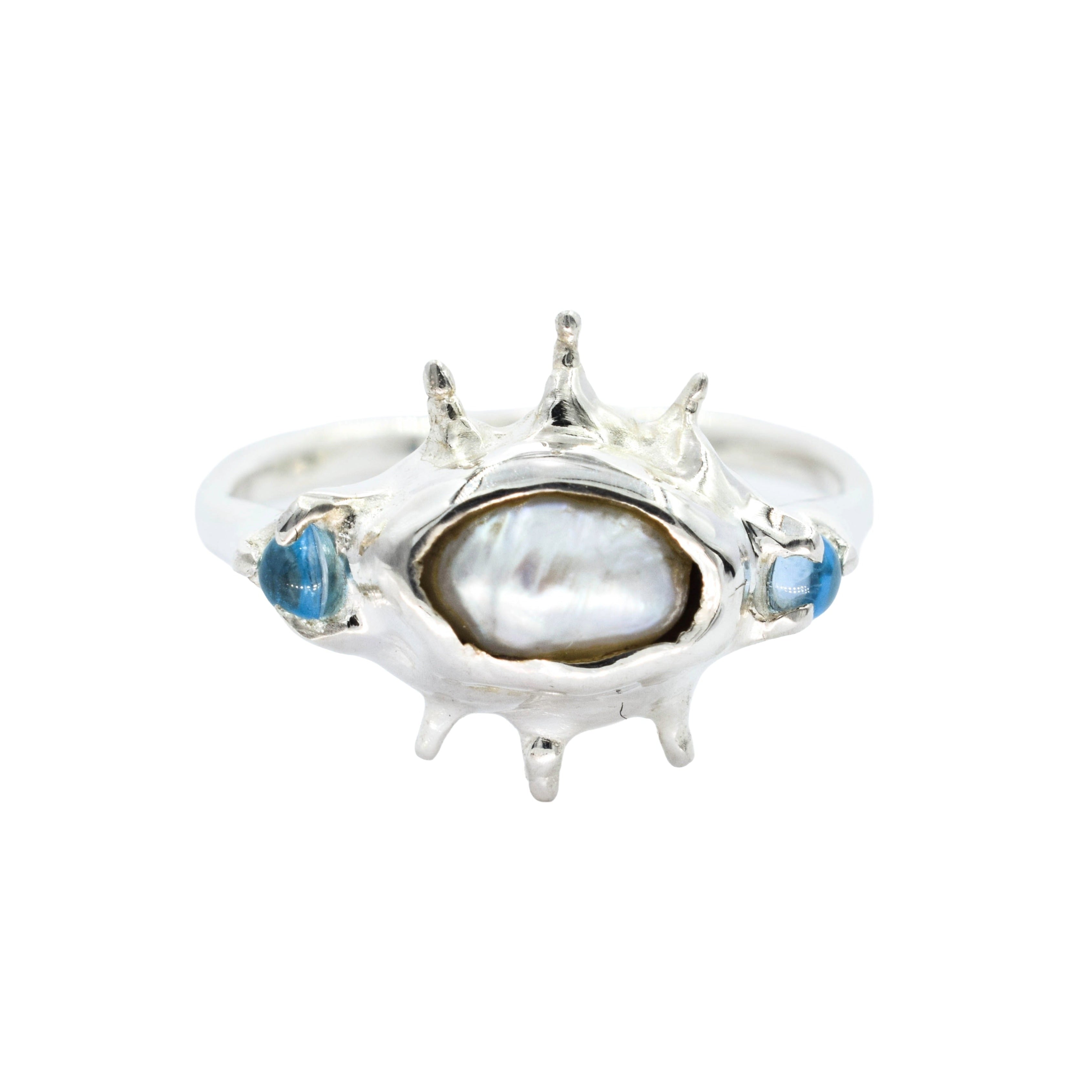 Ocean inspired ring with raw irregular pearl and blue topaz