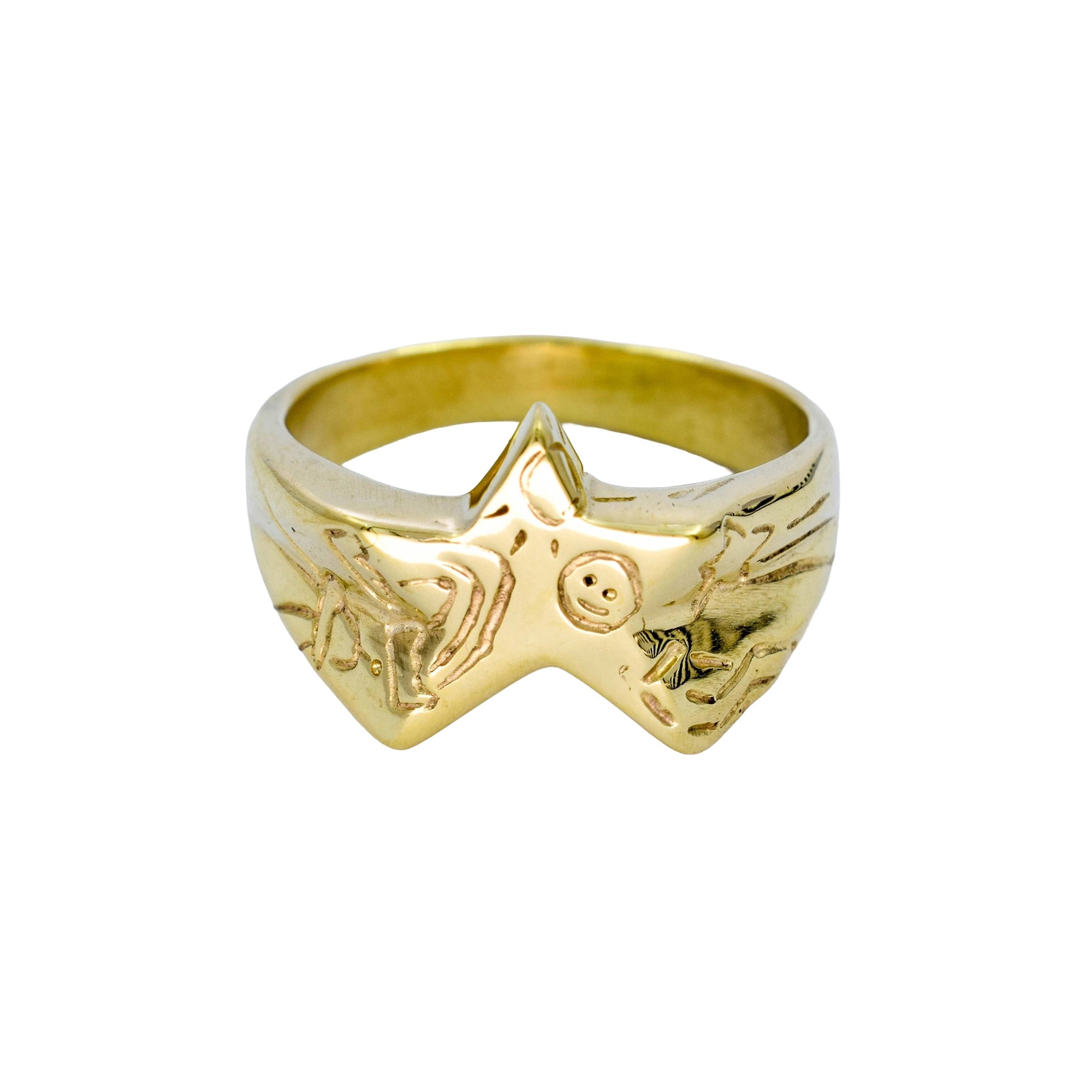 Gold ring with star design on a white background