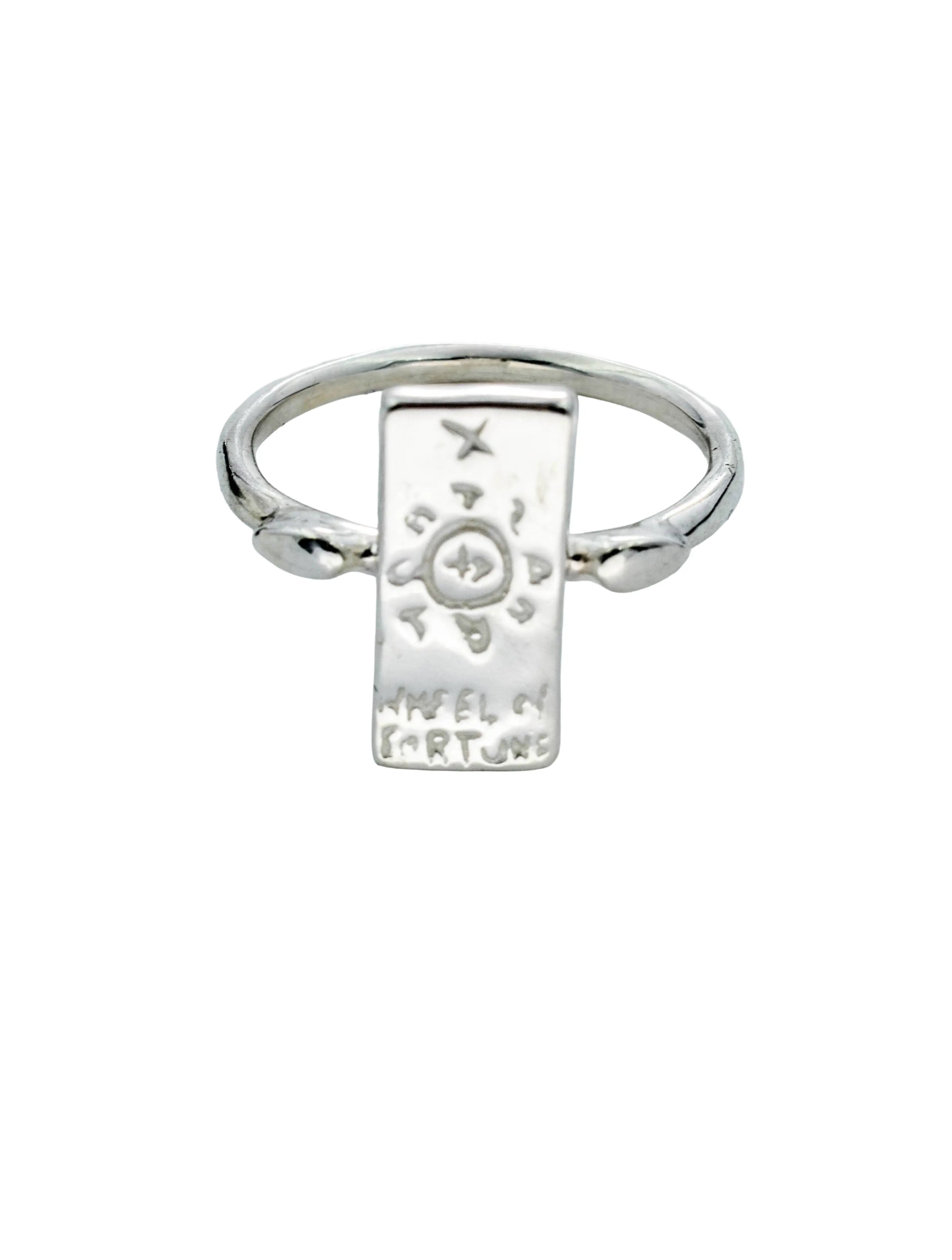 A sterling silver ring featuring a flat rectangular plate engraved with a compass and the words 'MABEL OF FORTUNE', set on a plain white background.