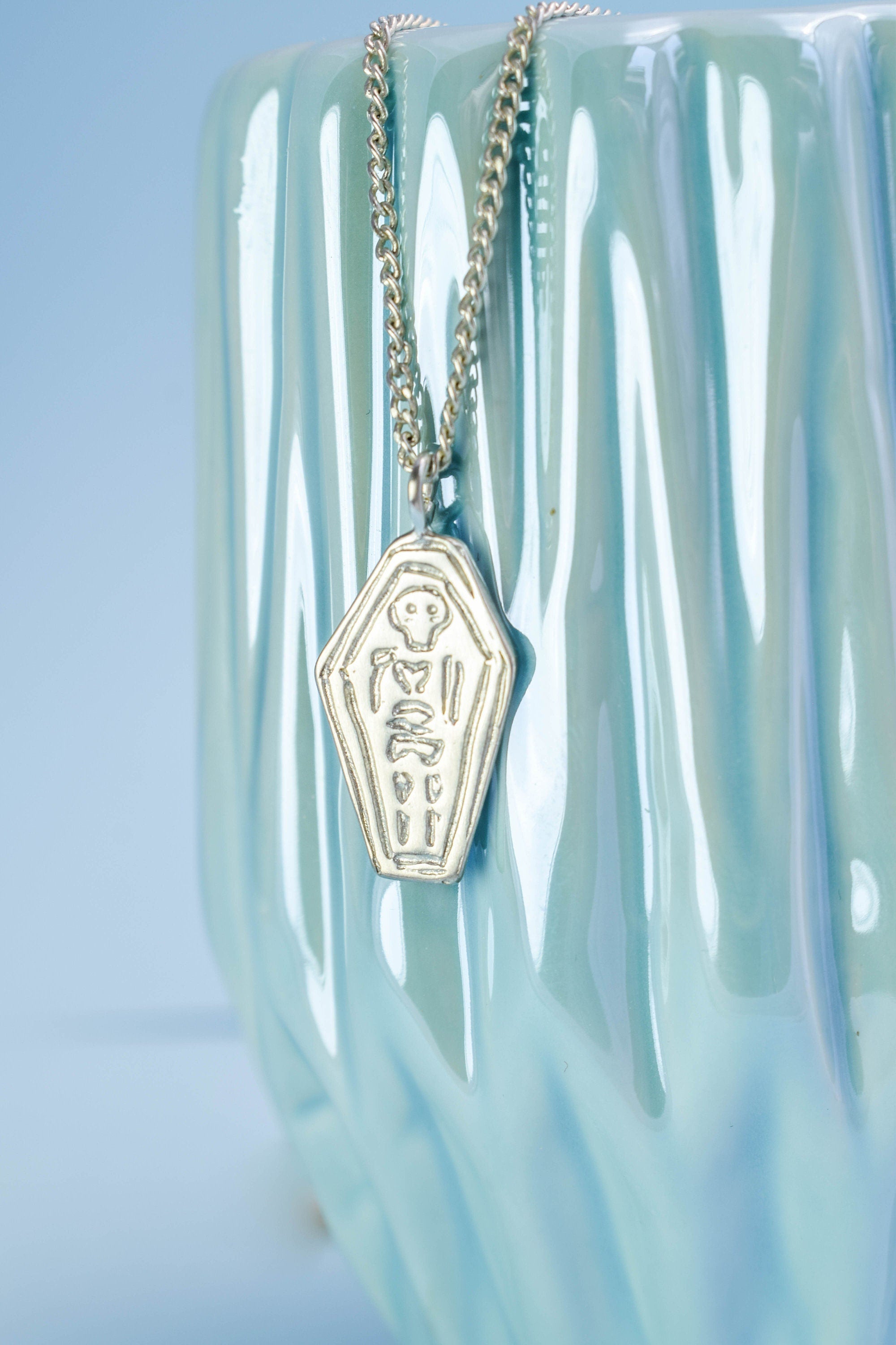 Skeleton in a coffin necklace