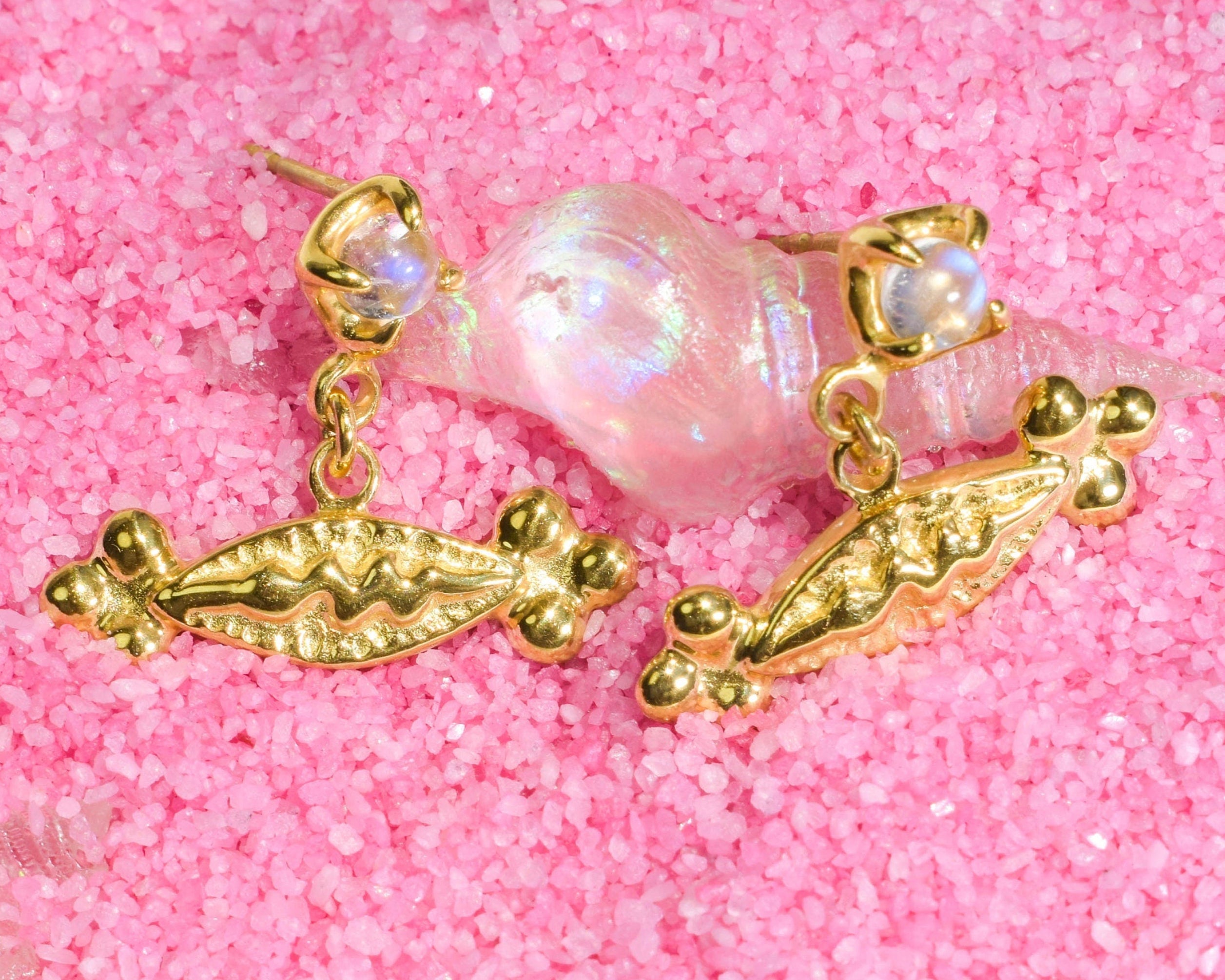 Elegant stud earrings with snake charms and moonstones