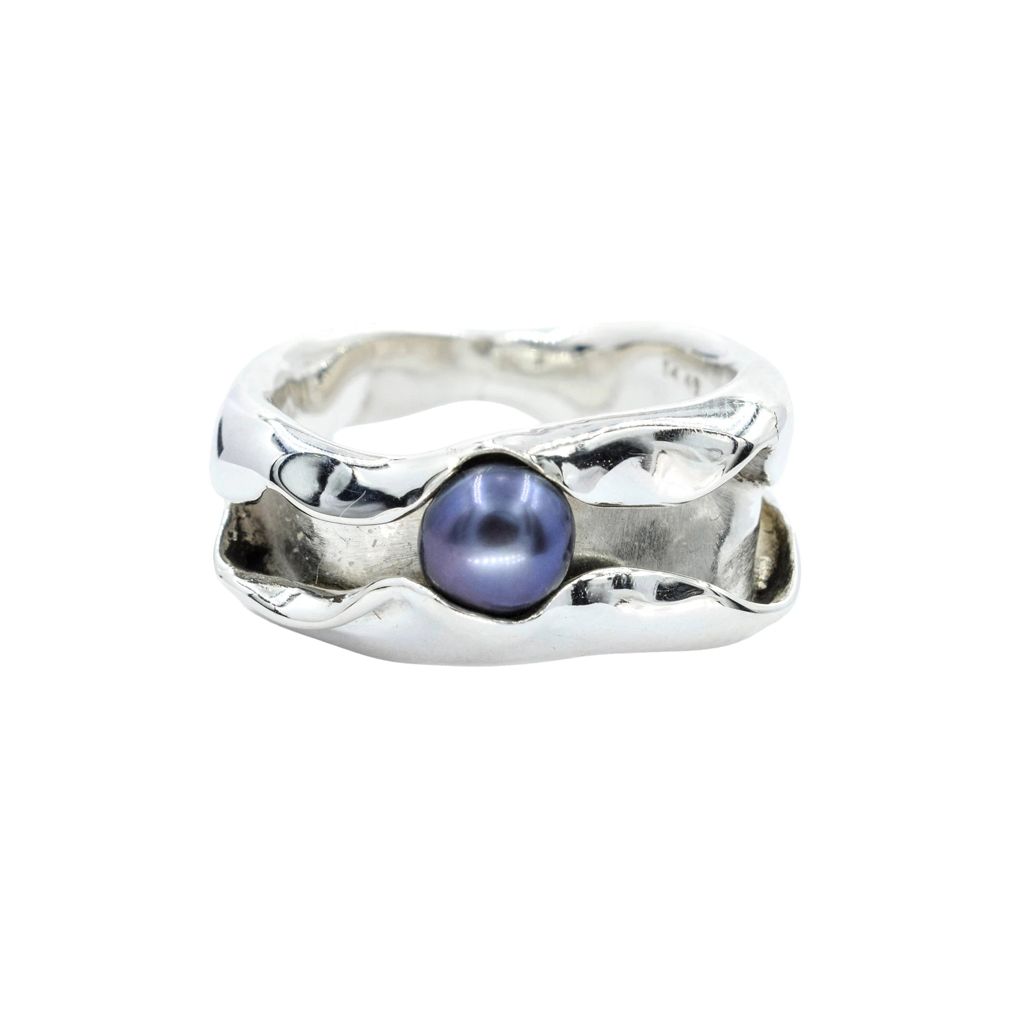 Silver ring with a purple pearl on a white background